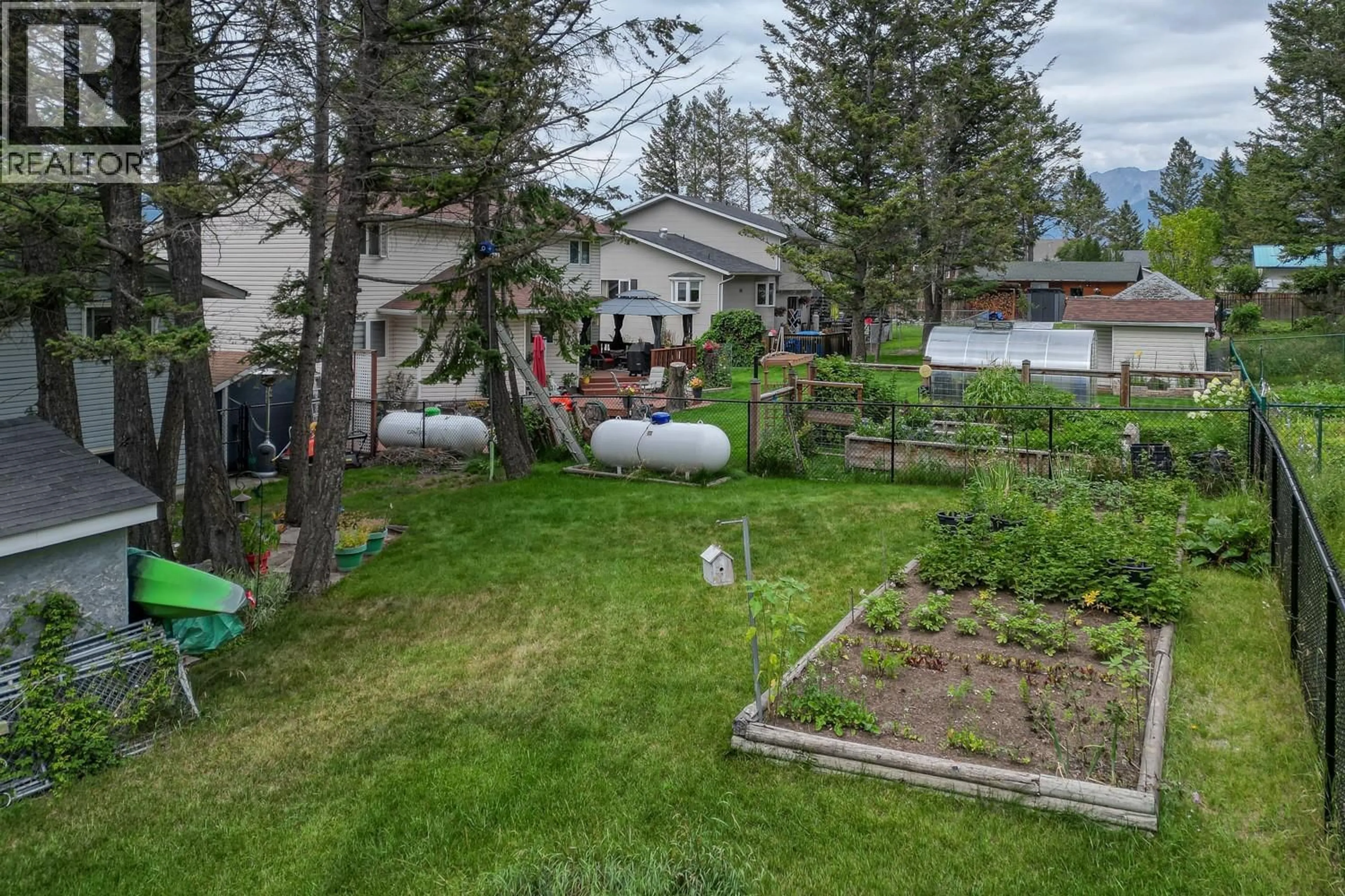 A pic from outside/outdoor area/front of a property/back of a property/a pic from drone, mountain view for 7496 RIVERCREST ROAD, Radium Hot Springs British Columbia V0A1M0