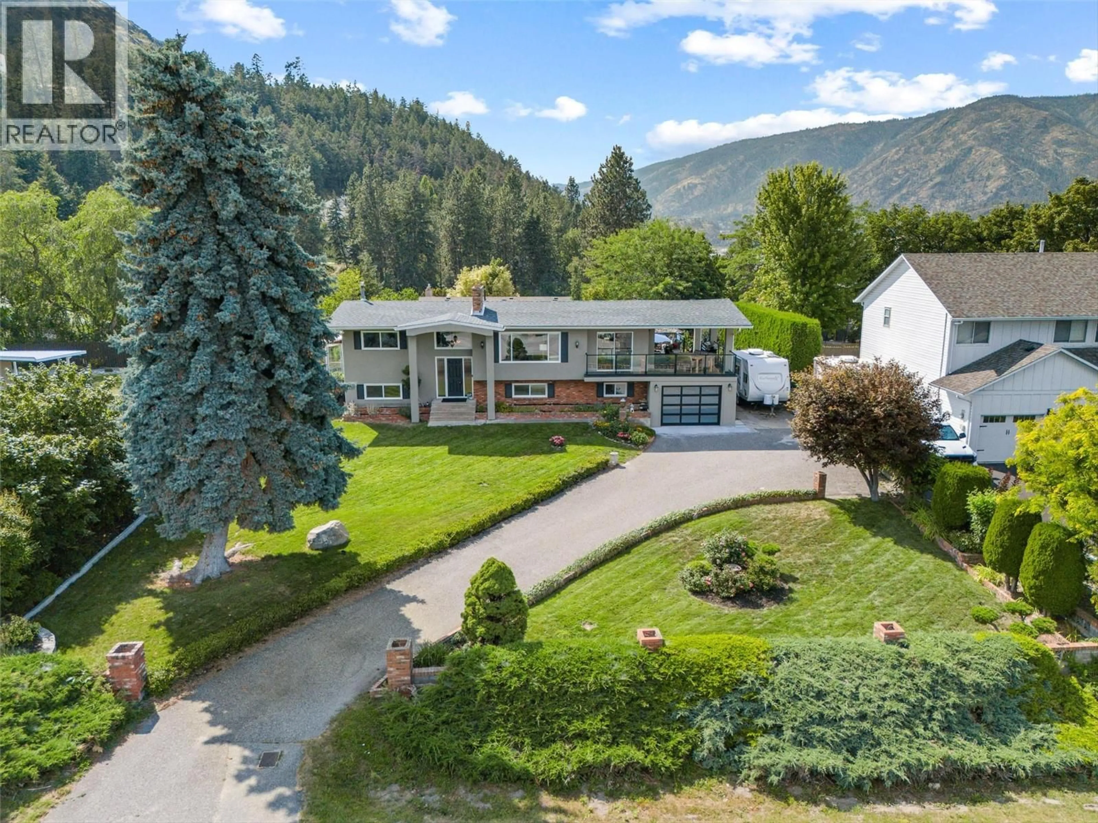 A pic from outside/outdoor area/front of a property/back of a property/a pic from drone, mountain view for 2710 GUIDI ROAD, West Kelowna British Columbia V1Z2K4