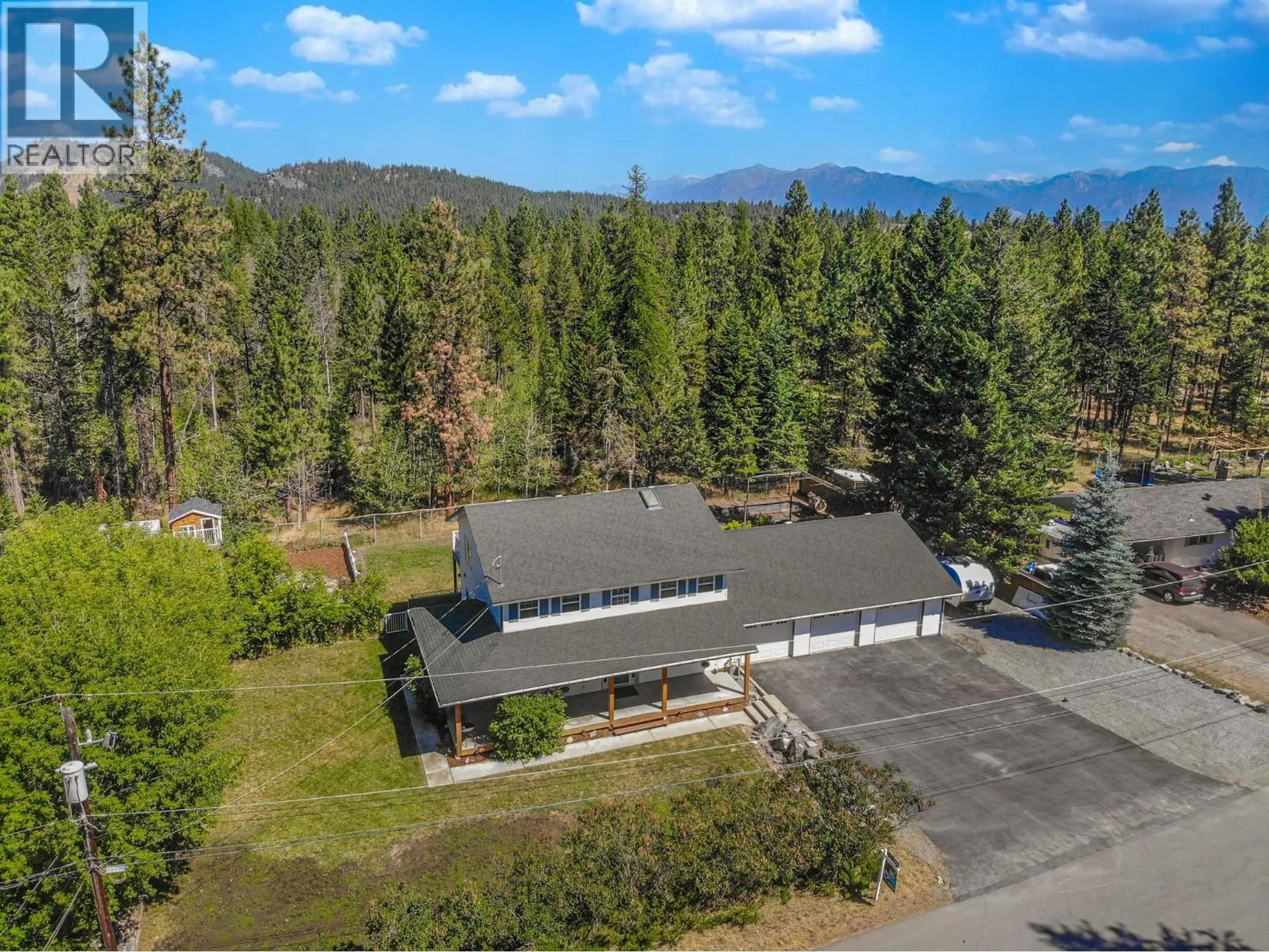 A pic from outside/outdoor area/front of a property/back of a property/a pic from drone, mountain view for 512 WILDWOOD DRIVE, Cranbrook British Columbia V1C6V1
