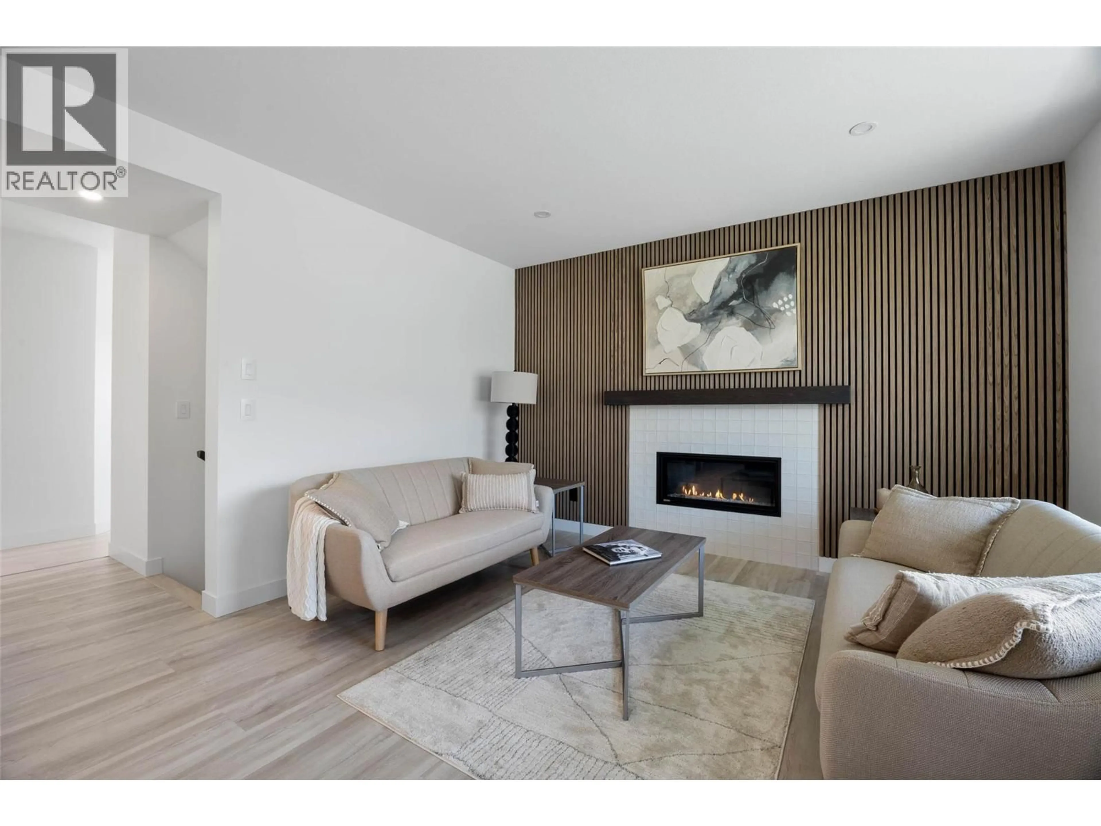 Living room with furniture, wood/laminate floor for 147 - 2050 GRASSLANDS BOULEVARD, Kamloops British Columbia V2B0K7