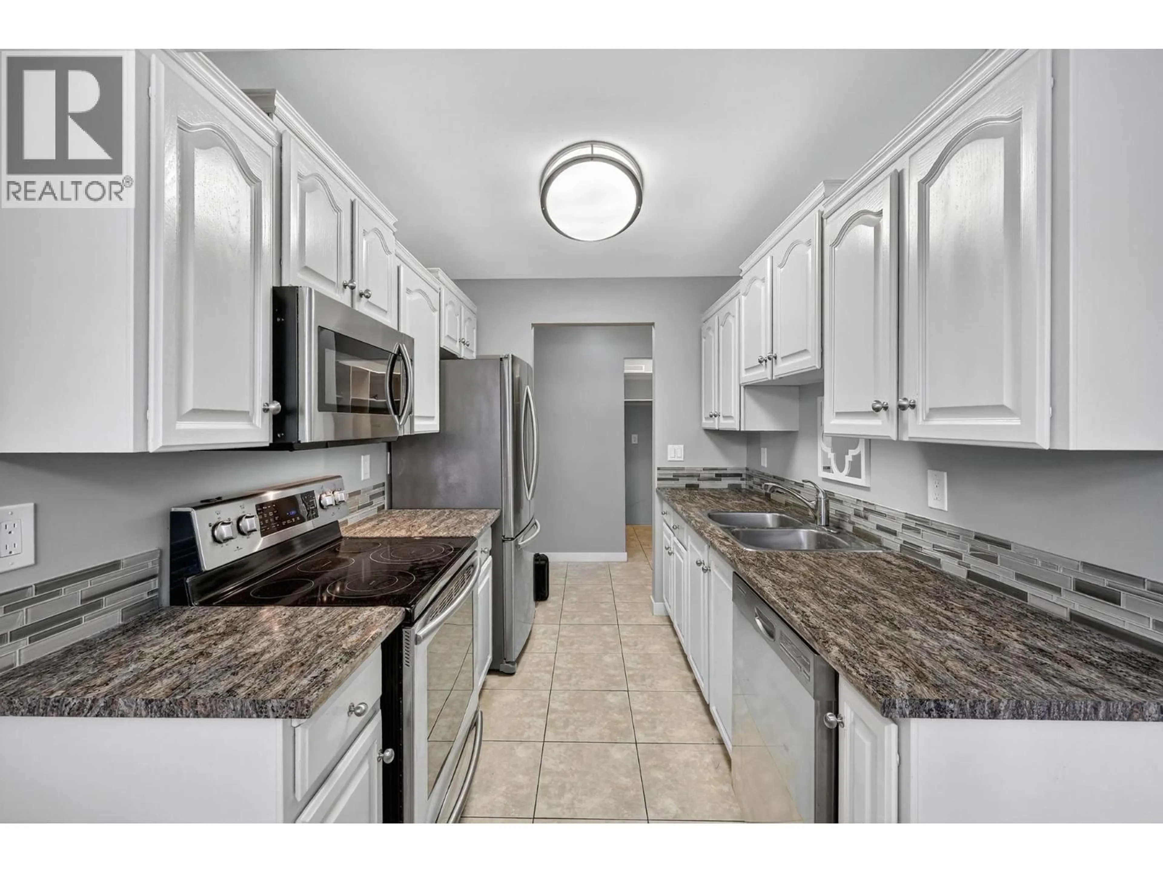 Standard kitchen, ceramic/tile floor for 105 - 1229 BERNARD AVENUE, Kelowna British Columbia V1Y6R3