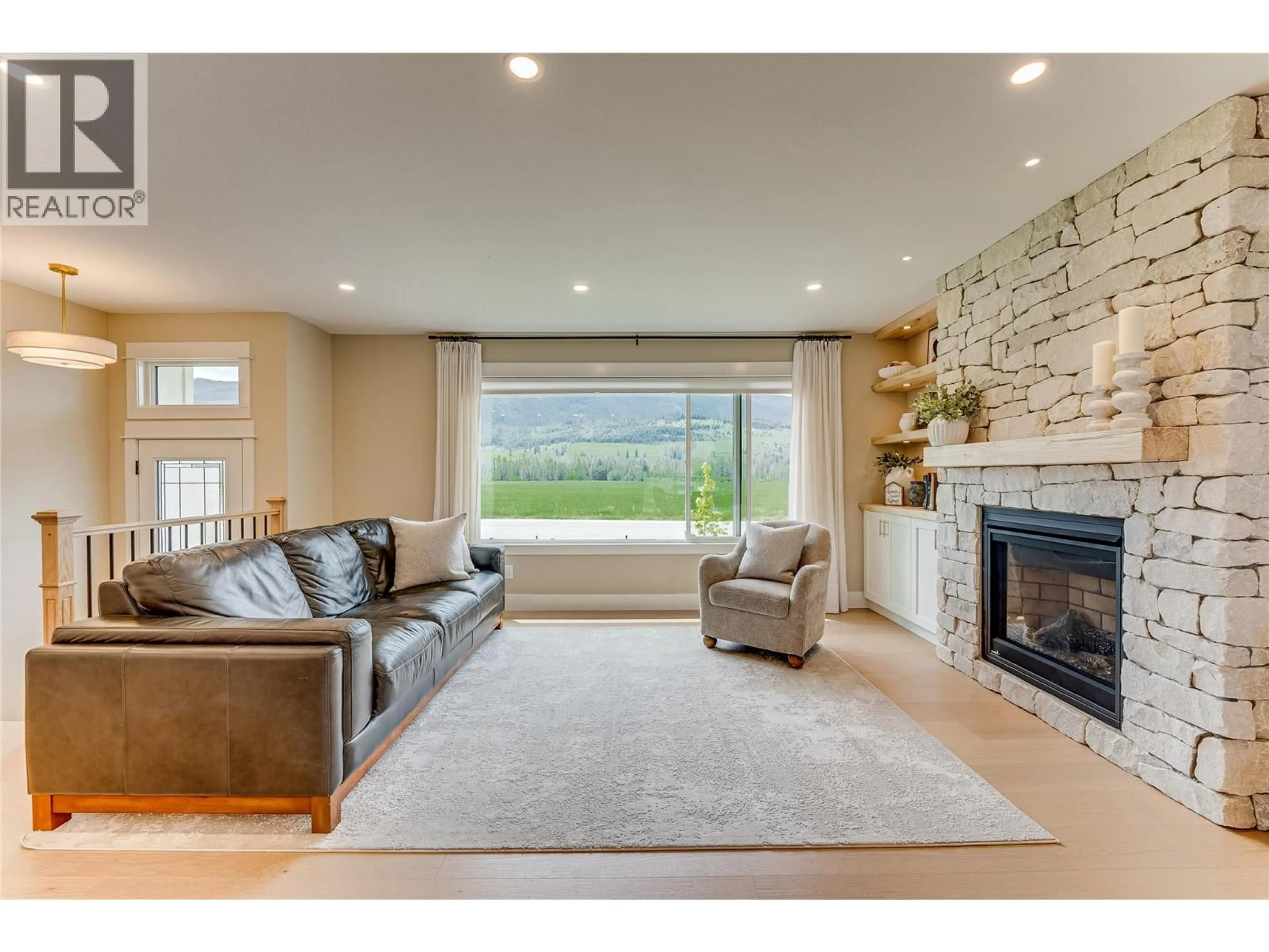 Living room with furniture, unknown for 8935 KALAMALKA ROAD, Coldstream British Columbia V1B3C2