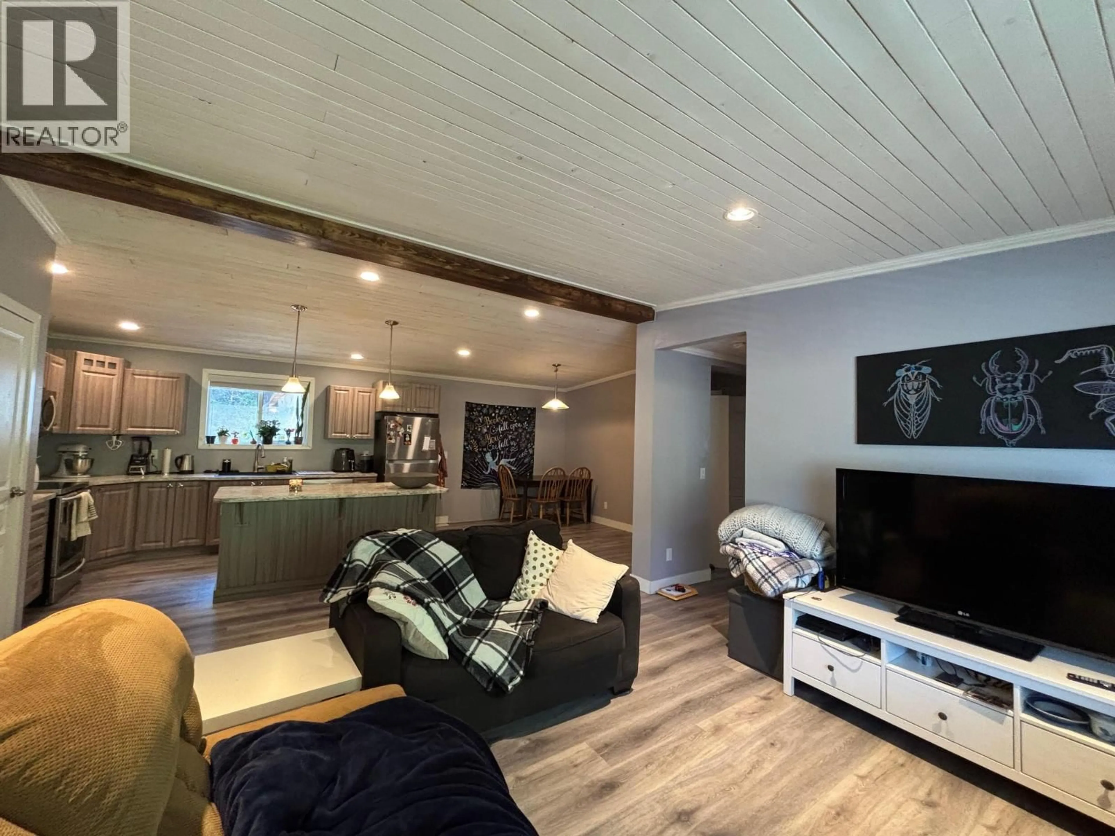 Living room with furniture, wood/laminate floor for 3520 33 HIGHWAY, Westbridge British Columbia V0H1Y0