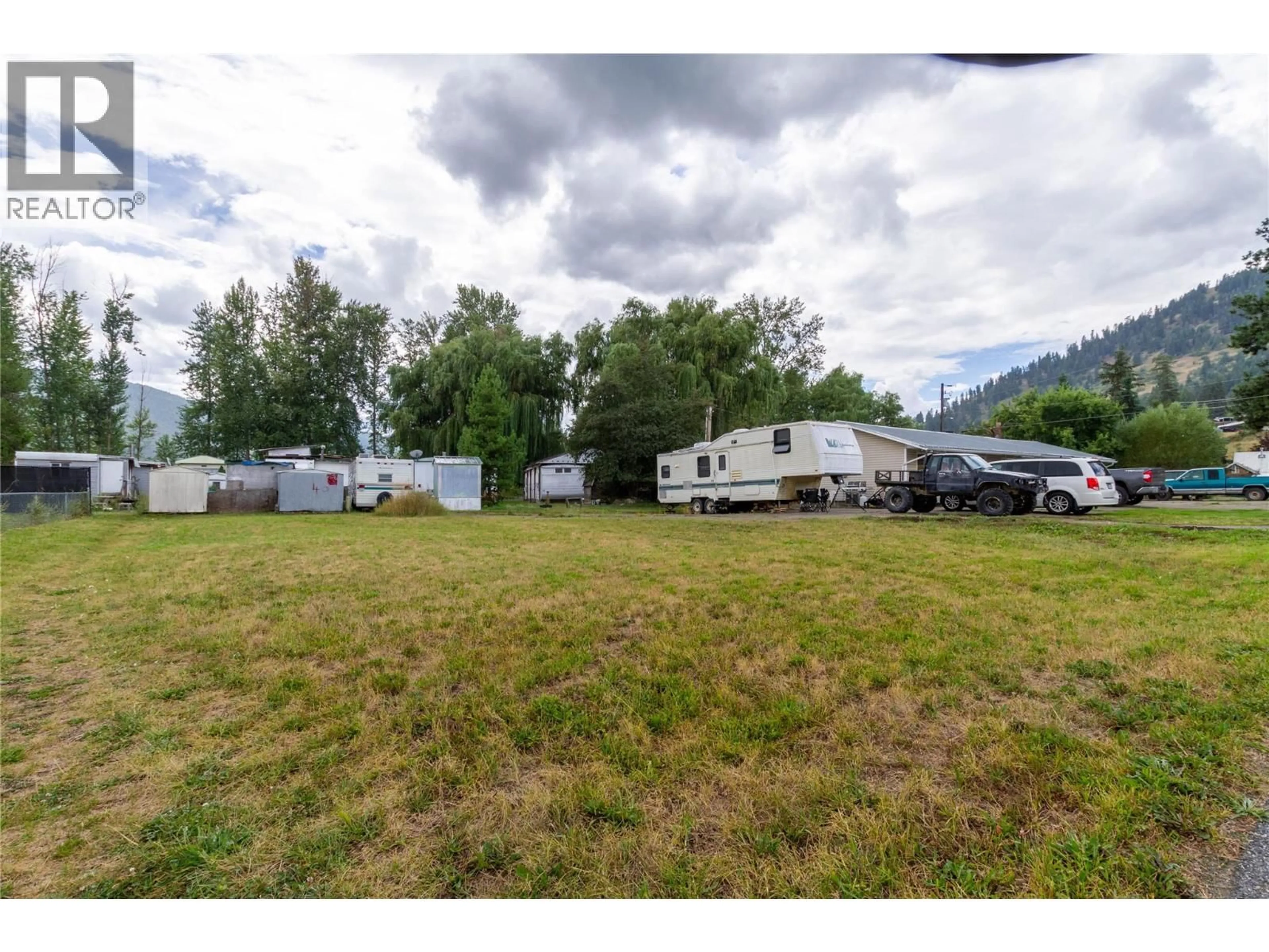 A pic from outside/outdoor area/front of a property/back of a property/a pic from drone, mountain view for 1,2,3 - 2184 BESSETTE STREET, Lumby British Columbia V0E2G0