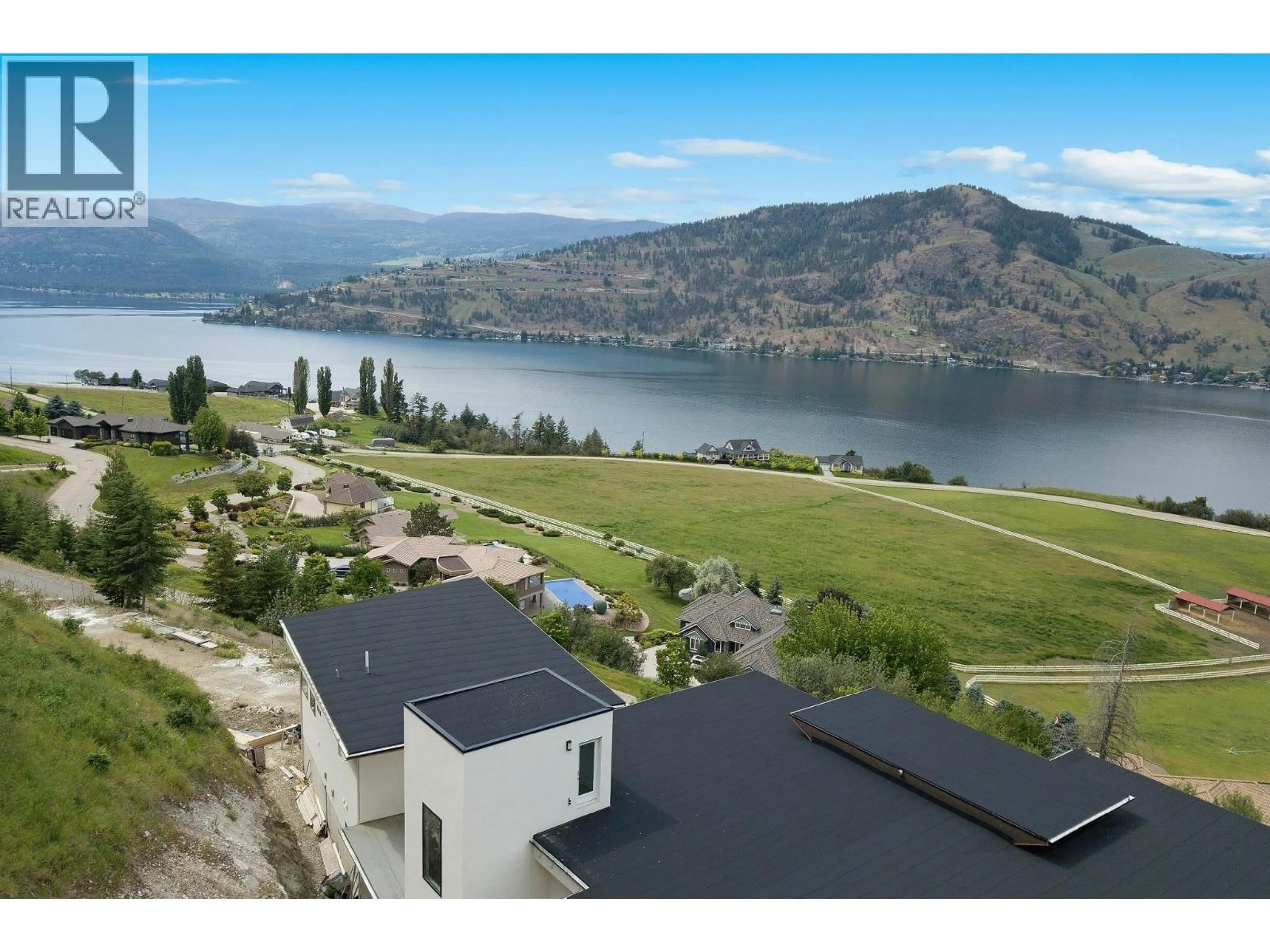 A pic from outside/outdoor area/front of a property/back of a property/a pic from drone, water/lake/river/ocean view for 120 SUNSET BOULEVARD, Vernon British Columbia V1H1T7