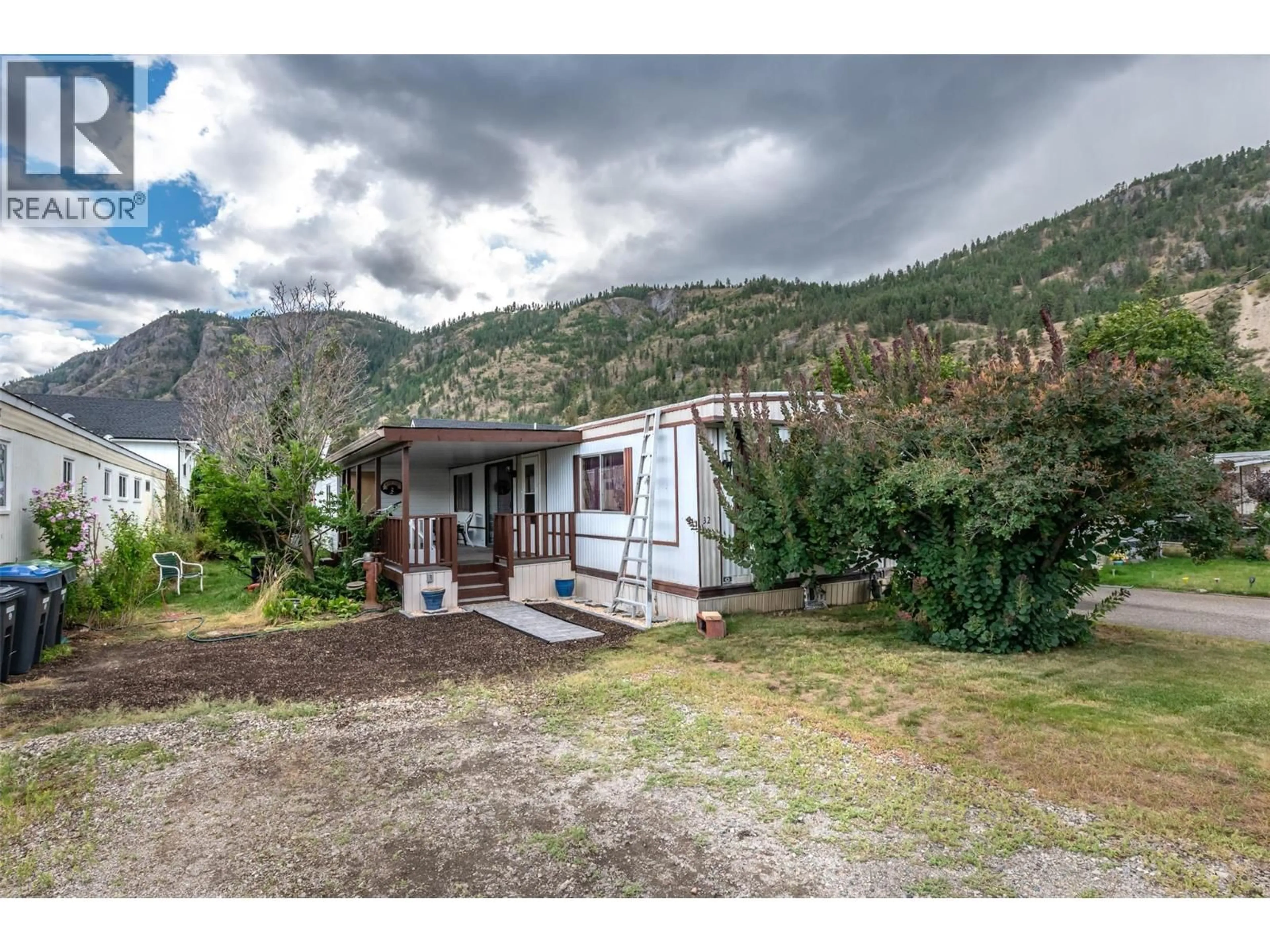 A pic from outside/outdoor area/front of a property/back of a property/a pic from drone, mountain view for 32 - 1302 CEDAR STREET, Okanagan Falls British Columbia V0H1R0