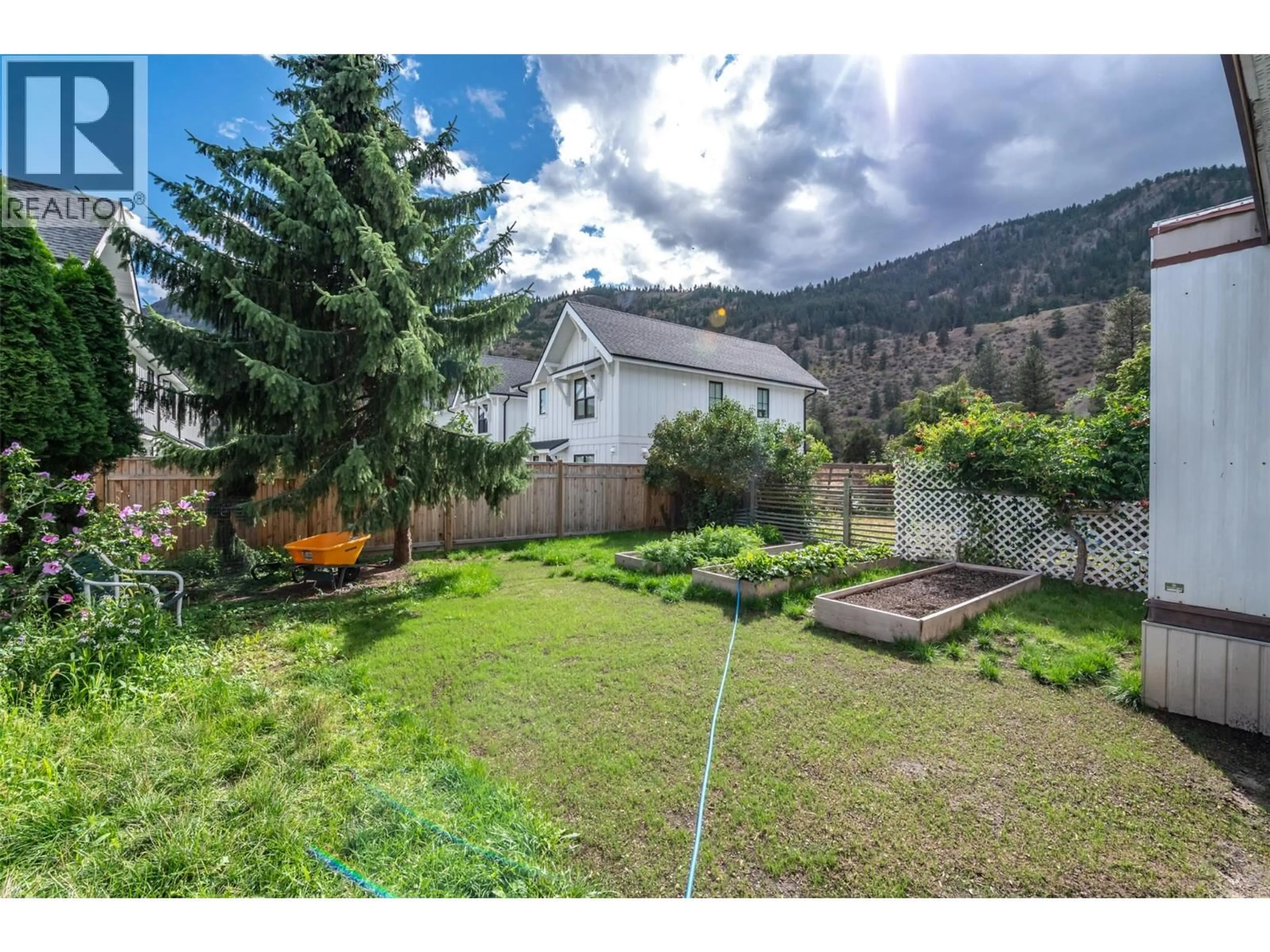A pic from outside/outdoor area/front of a property/back of a property/a pic from drone, mountain view for 32 - 1302 CEDAR STREET, Okanagan Falls British Columbia V0H1R0
