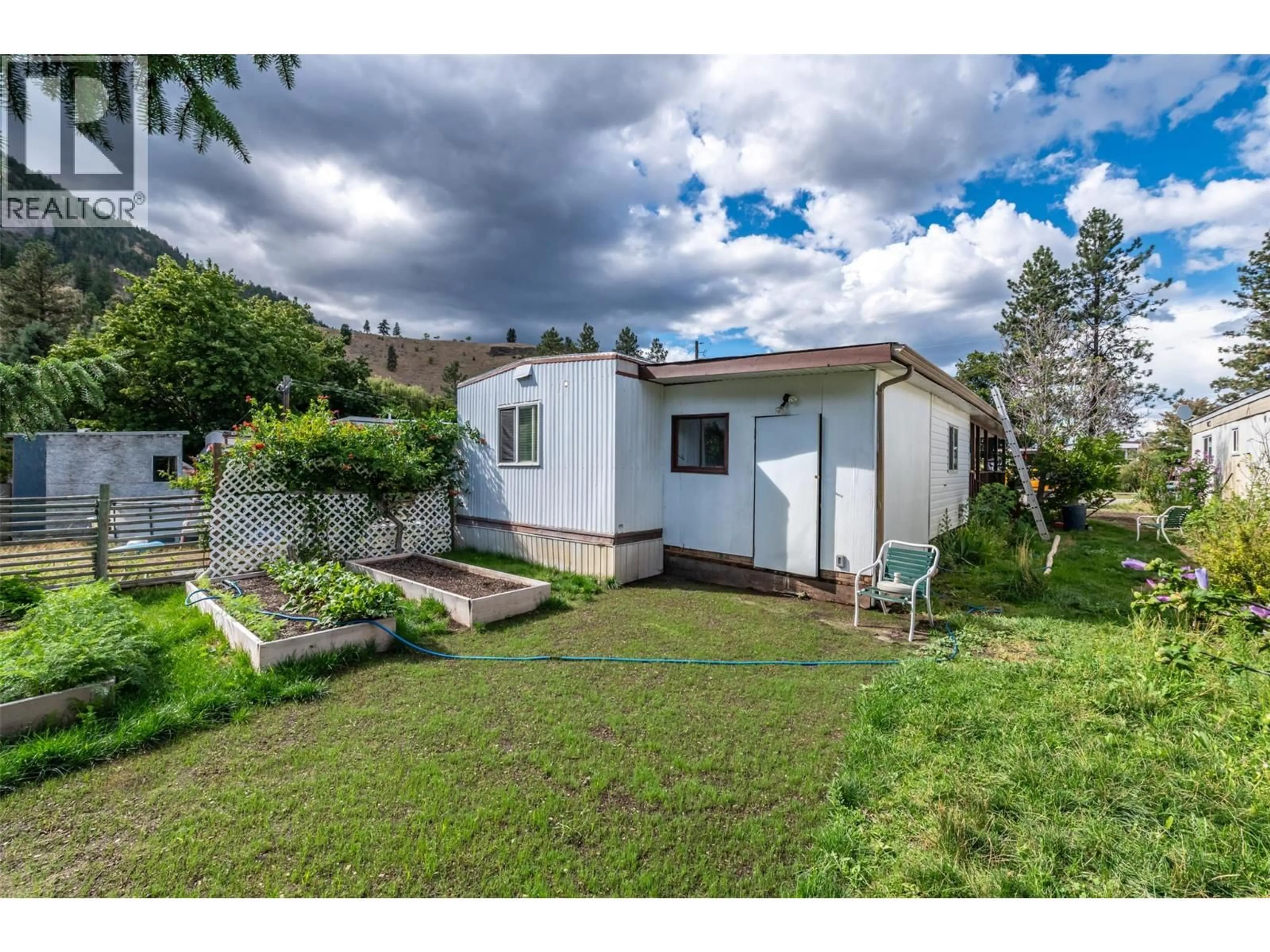 A pic from outside/outdoor area/front of a property/back of a property/a pic from drone, street for 32 - 1302 CEDAR STREET, Okanagan Falls British Columbia V0H1R0