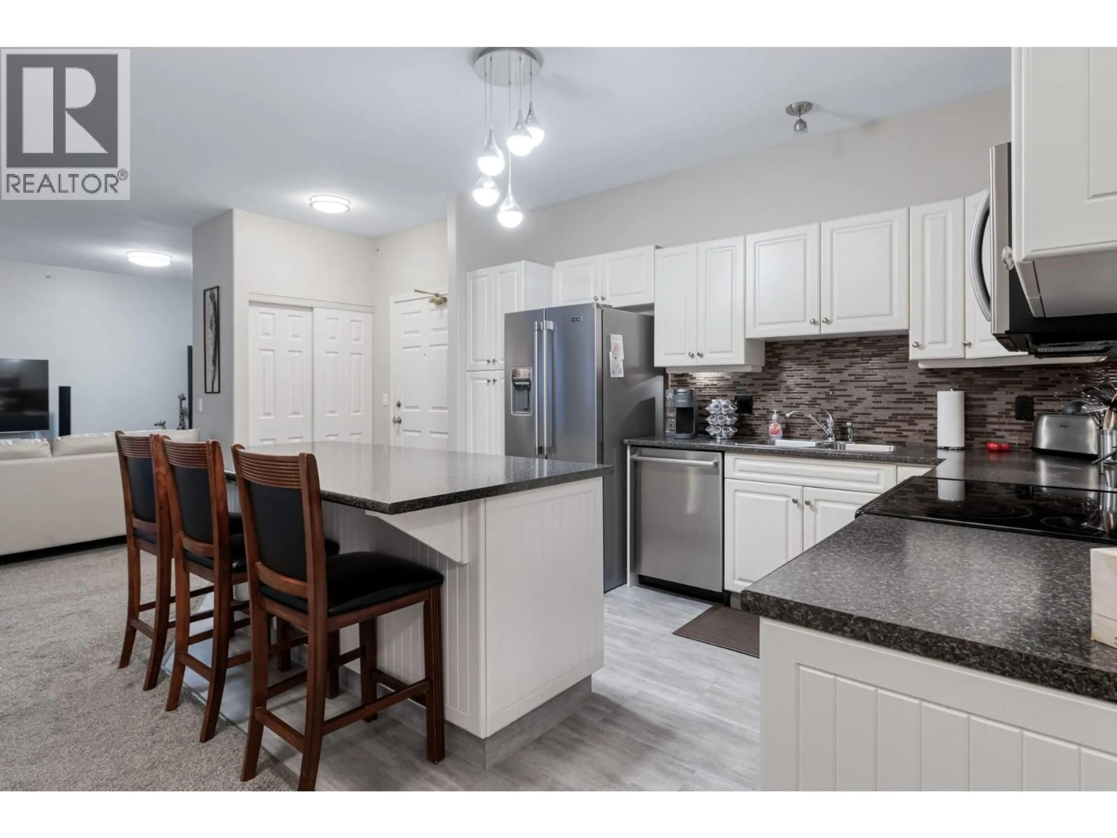 Open concept kitchen, ceramic/tile floor for 407 - 1950 DURNIN ROAD, Kelowna British Columbia V1X7W6