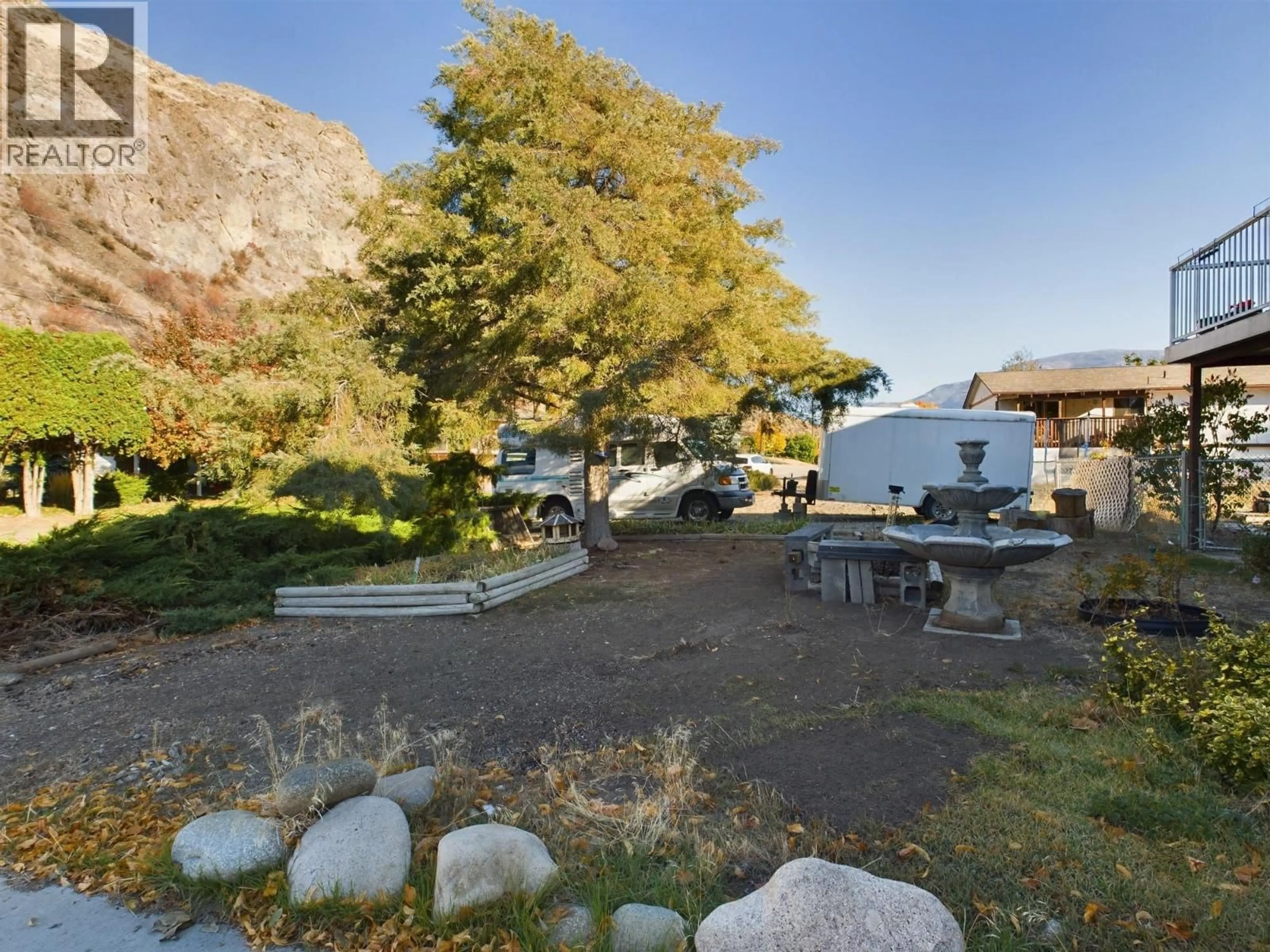 A pic from outside/outdoor area/front of a property/back of a property/a pic from drone, mountain view for 1013 MORNINGSTAR ROAD, Oliver British Columbia V0H1T6