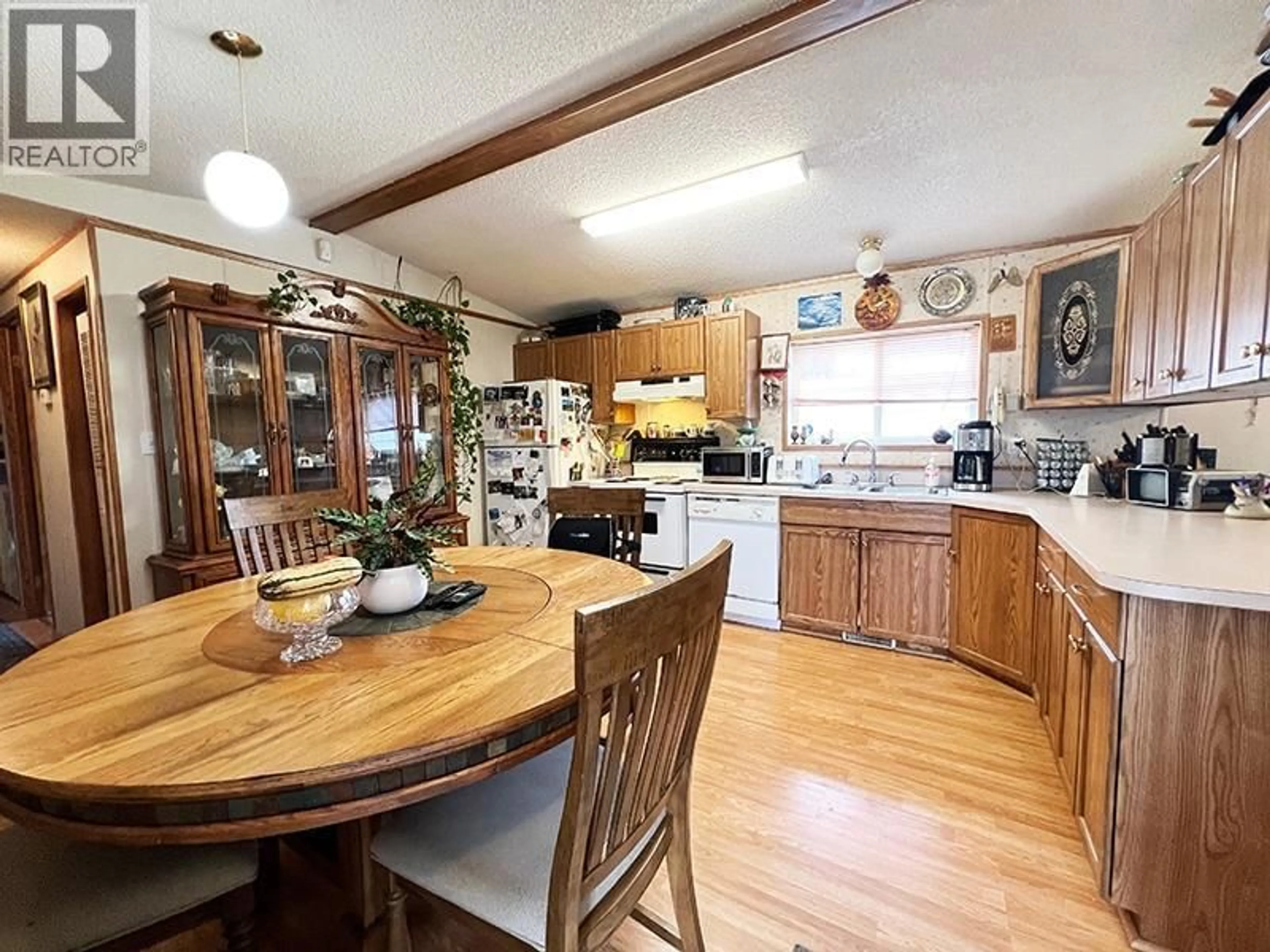 Open concept kitchen, wood/laminate floor for 14 PLUTO DRIVE, Kamloops British Columbia V2H1T7