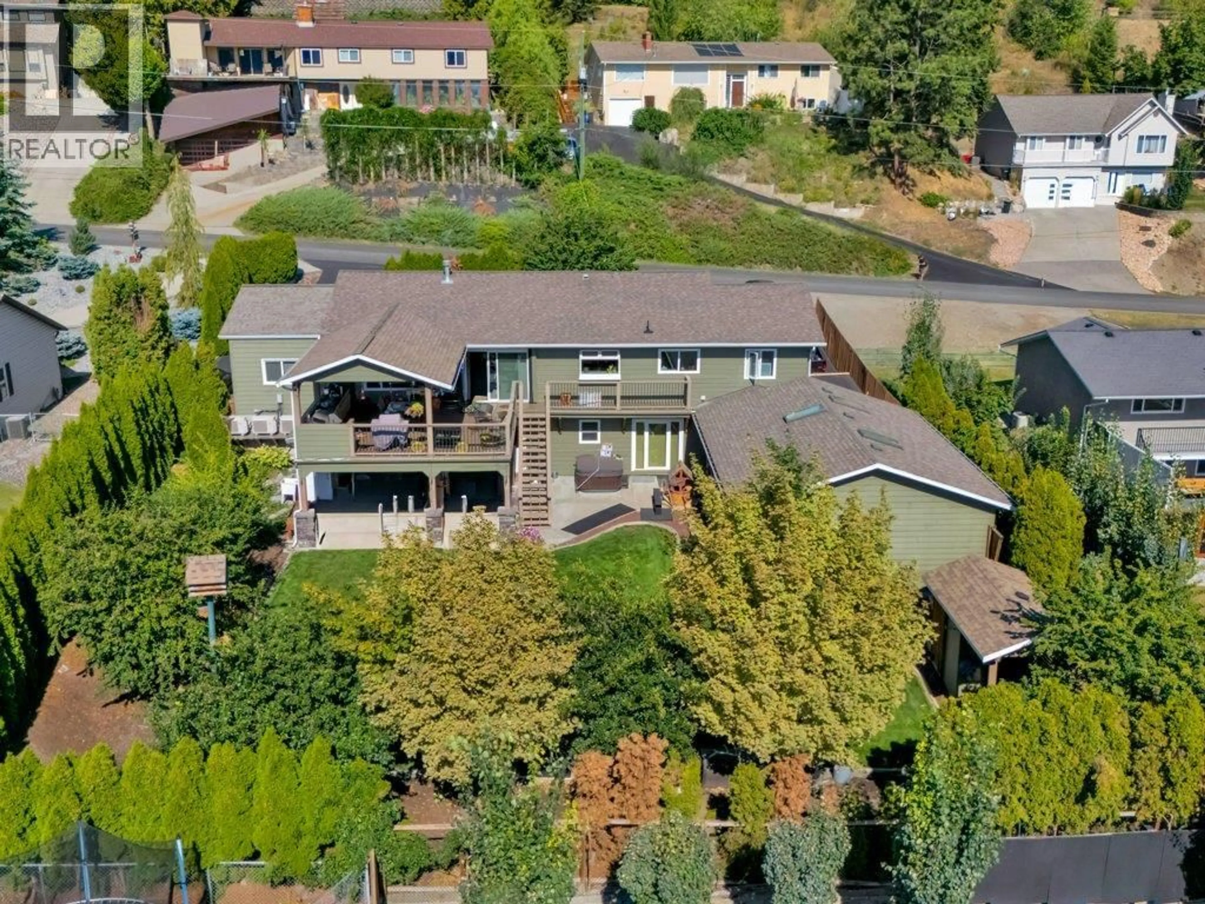 A pic from outside/outdoor area/front of a property/back of a property/a pic from drone, street for 6475 BLUE JAY ROAD, Vernon British Columbia V1H1W5