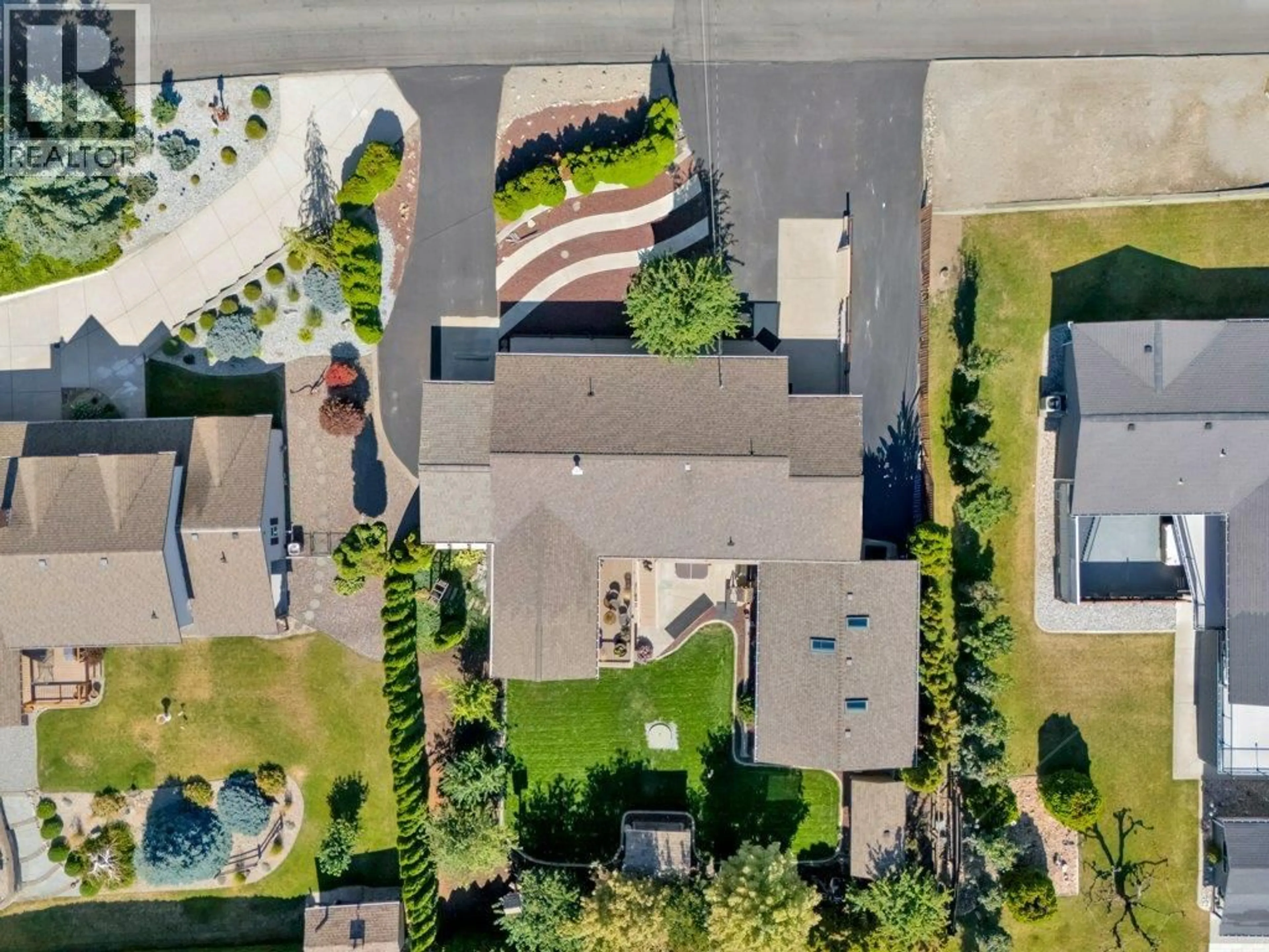 A pic from outside/outdoor area/front of a property/back of a property/a pic from drone, street for 6475 BLUE JAY ROAD, Vernon British Columbia V1H1W5