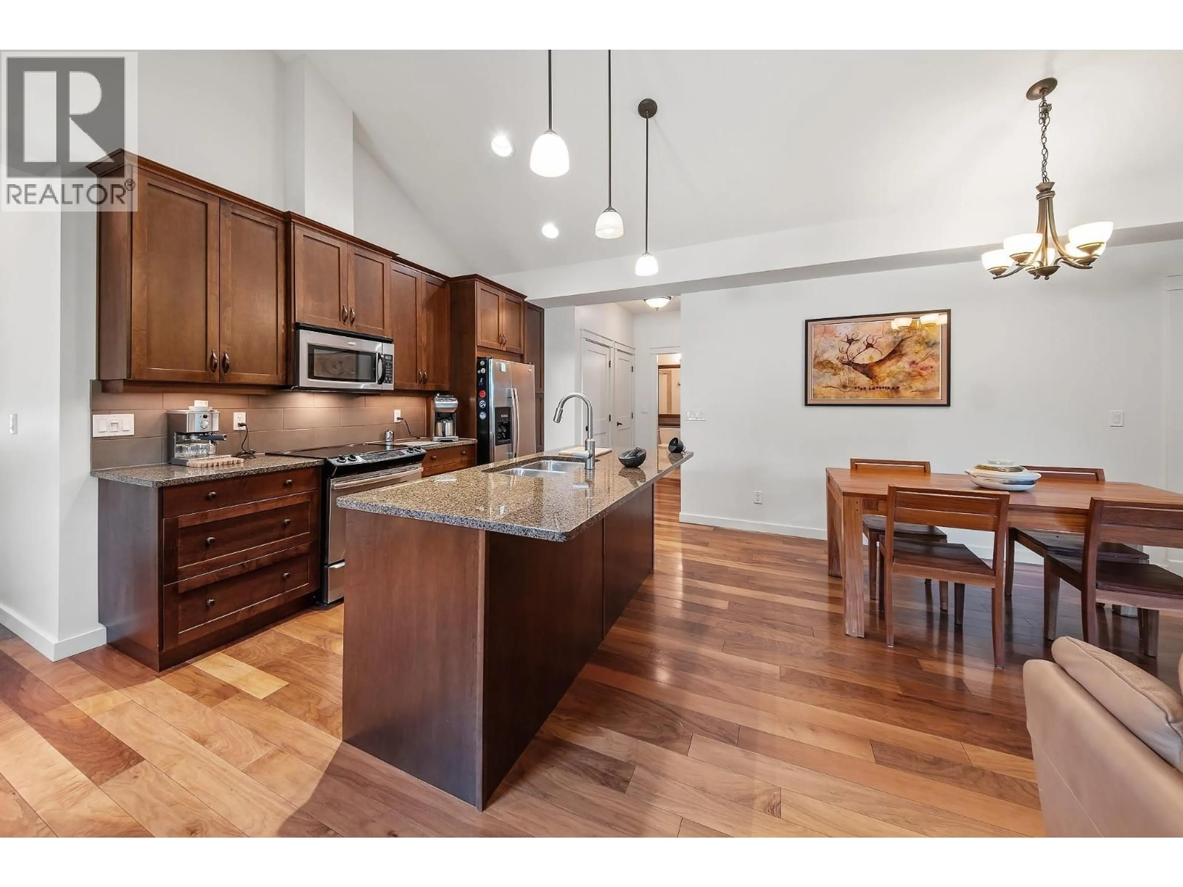 Open concept kitchen, wood/laminate floor for 214 - 511 YATES ROAD, Kelowna British Columbia V1V2X2