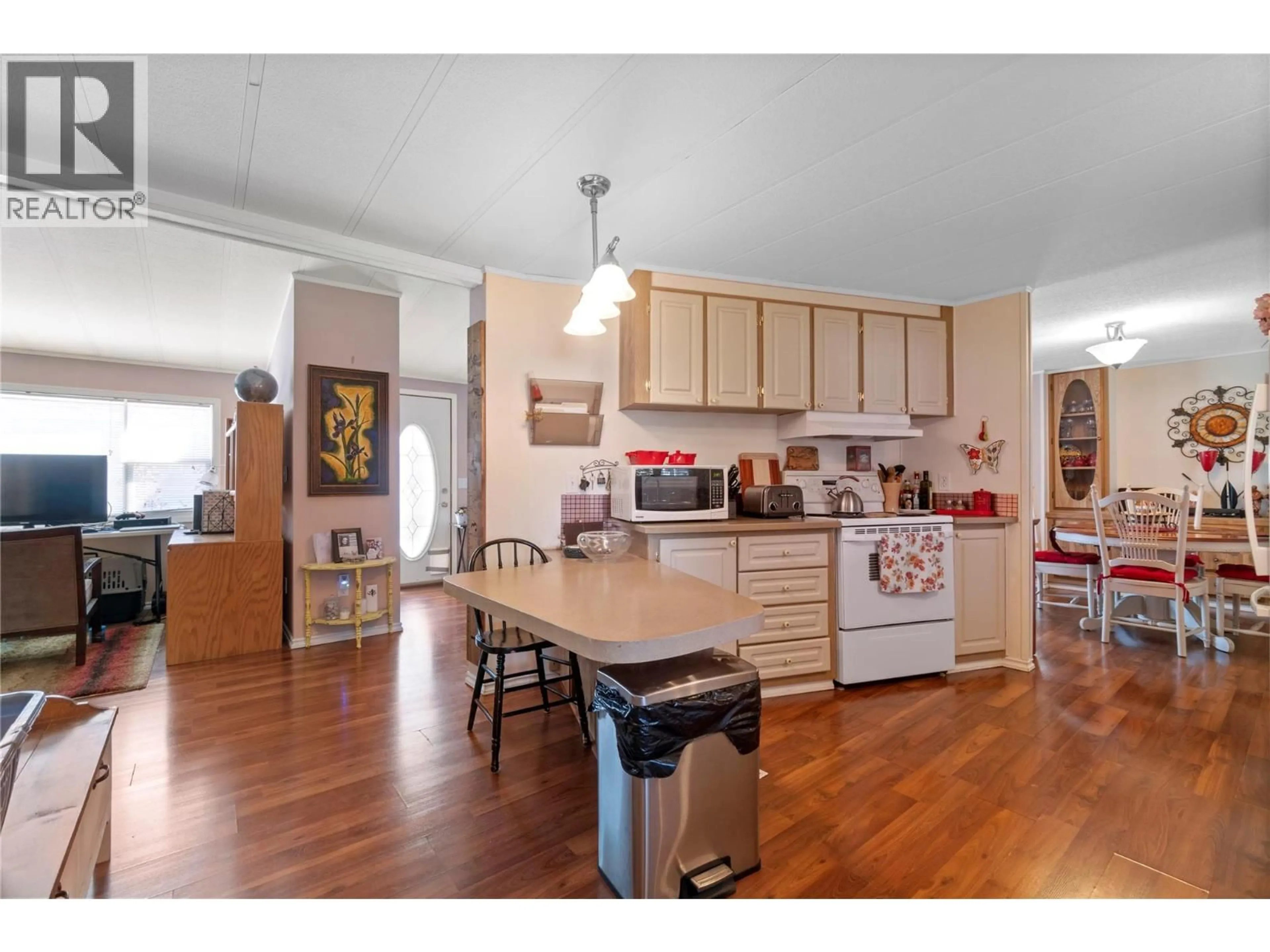 Open concept kitchen, wood/laminate floor for 16 - 1361 30 STREET SOUTHEAST, Salmon Arm British Columbia V1E2N4
