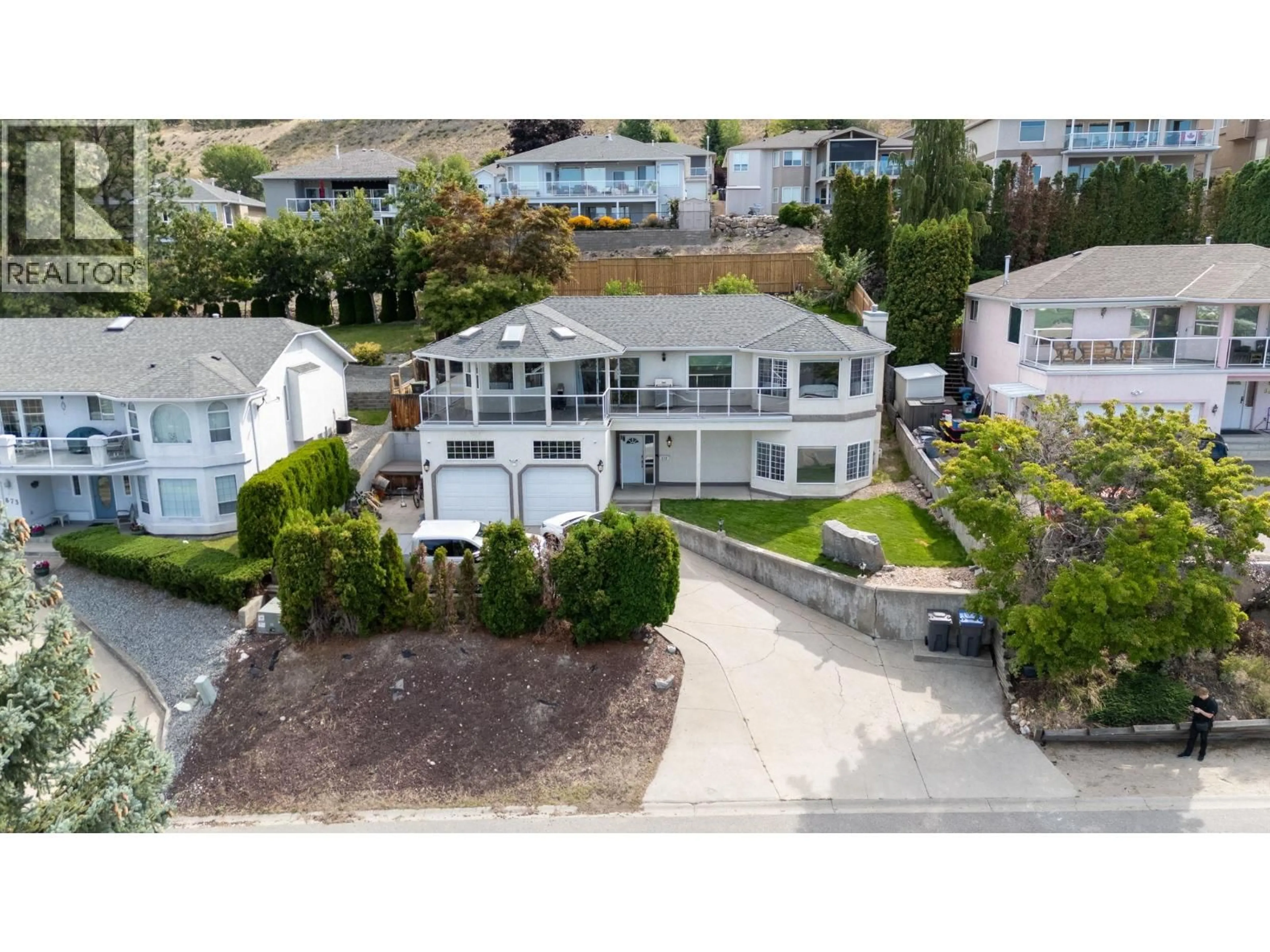 A pic from outside/outdoor area/front of a property/back of a property/a pic from drone, street for 877 TOOVEY ROAD, Kelowna British Columbia V1X6R2