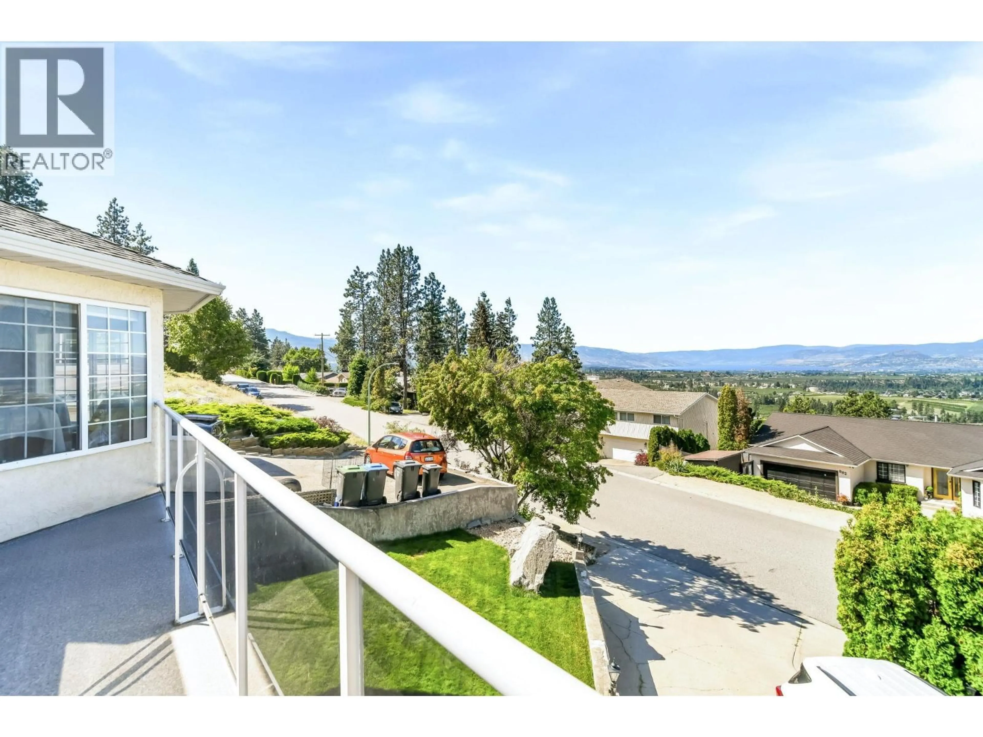A pic from outside/outdoor area/front of a property/back of a property/a pic from drone, mountain view for 877 TOOVEY ROAD, Kelowna British Columbia V1X6R2