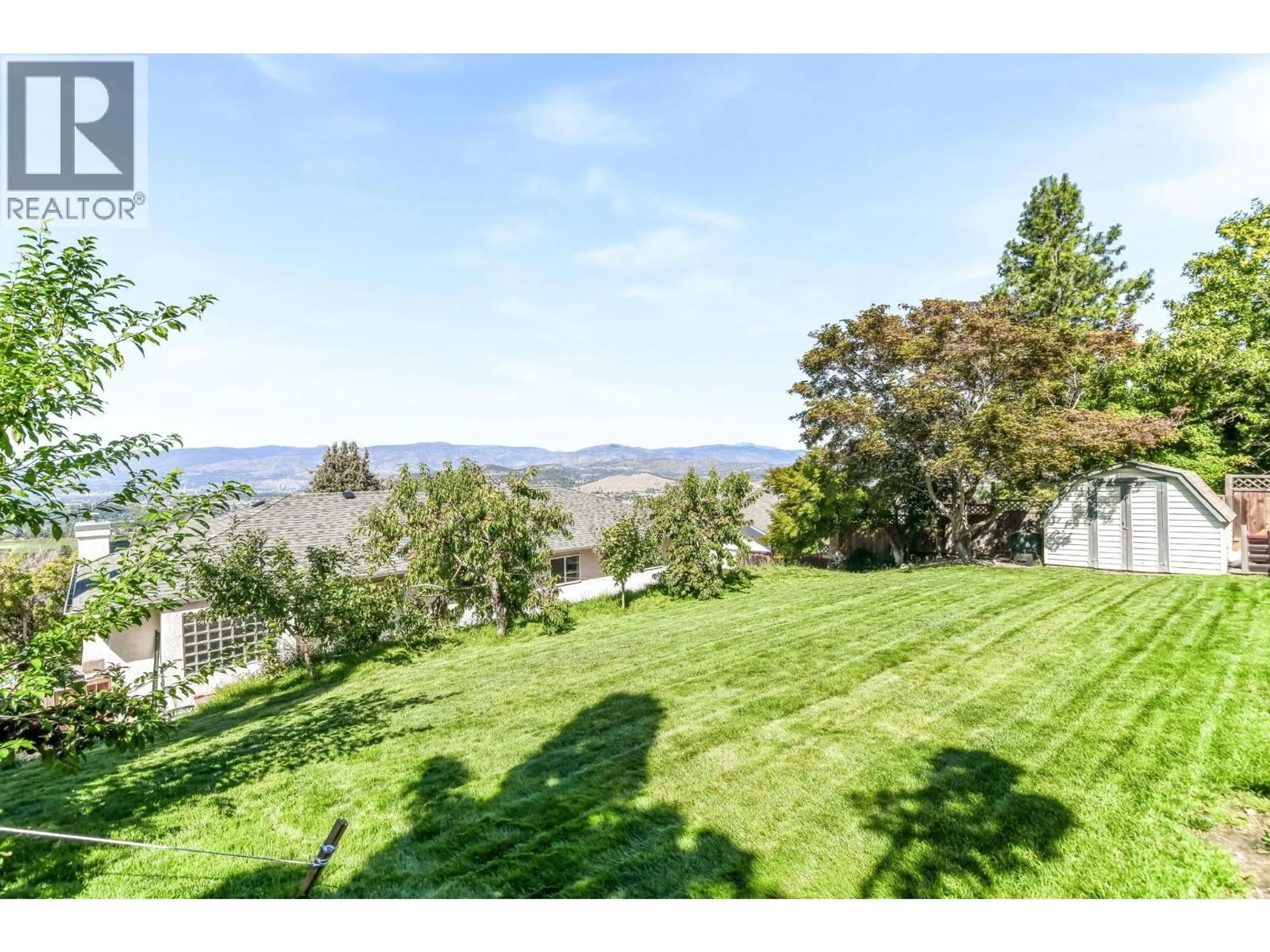 A pic from outside/outdoor area/front of a property/back of a property/a pic from drone, water/lake/river/ocean view for 877 TOOVEY ROAD, Kelowna British Columbia V1X6R2
