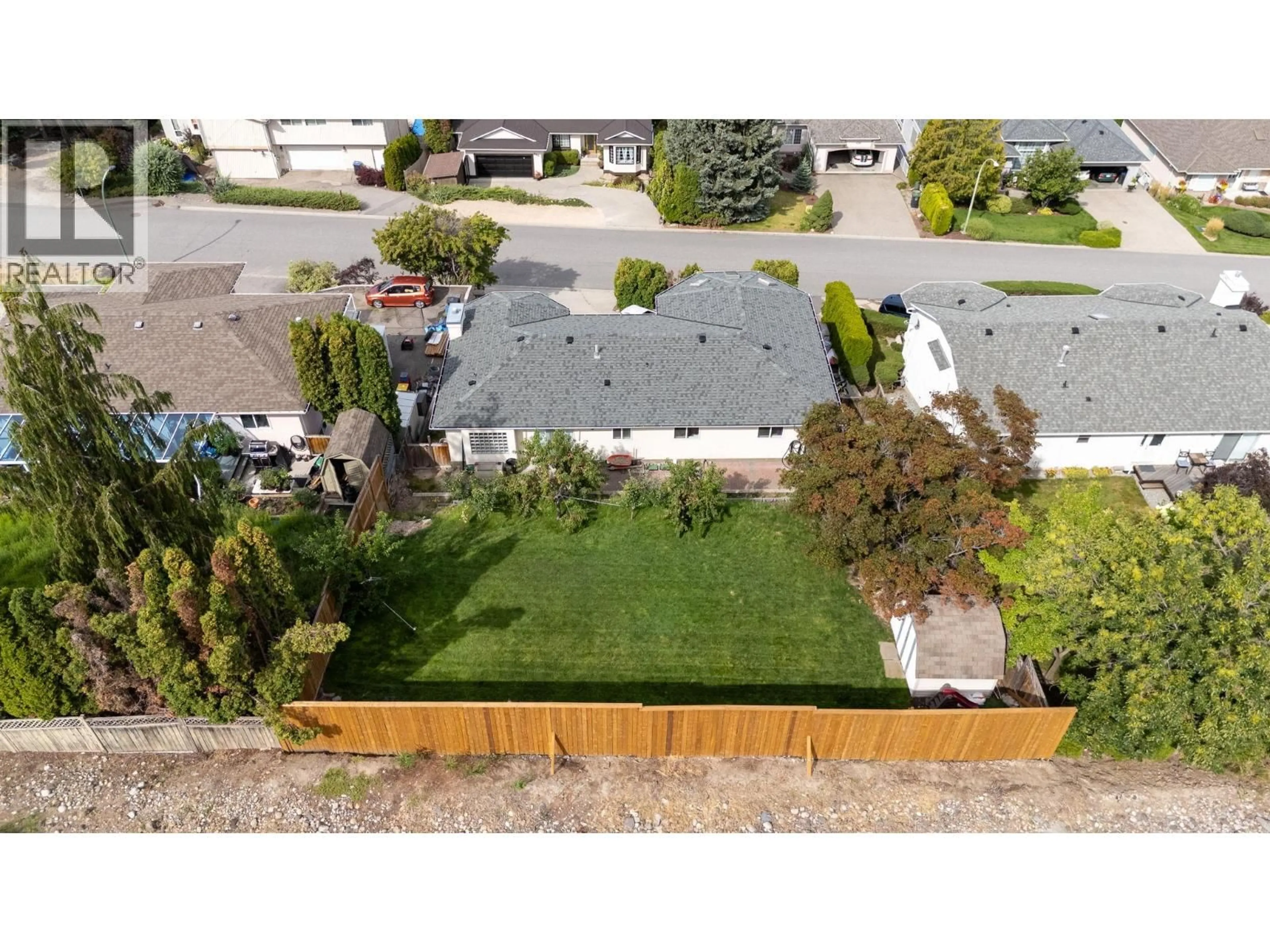 A pic from outside/outdoor area/front of a property/back of a property/a pic from drone, street for 877 TOOVEY ROAD, Kelowna British Columbia V1X6R2