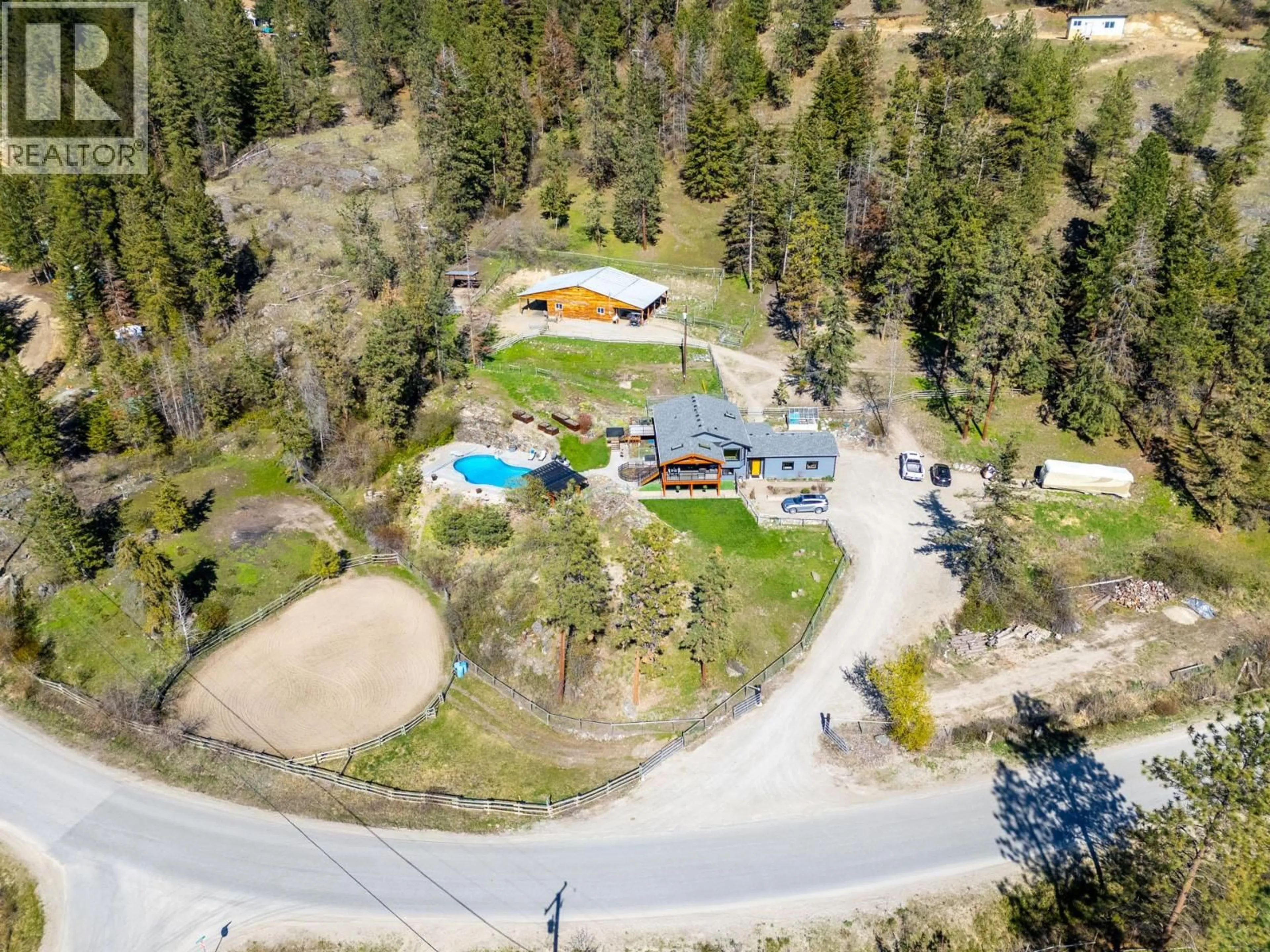 A pic from outside/outdoor area/front of a property/back of a property/a pic from drone, unknown for 6025 FARMERS DRIVE, Kelowna British Columbia V1P1A3