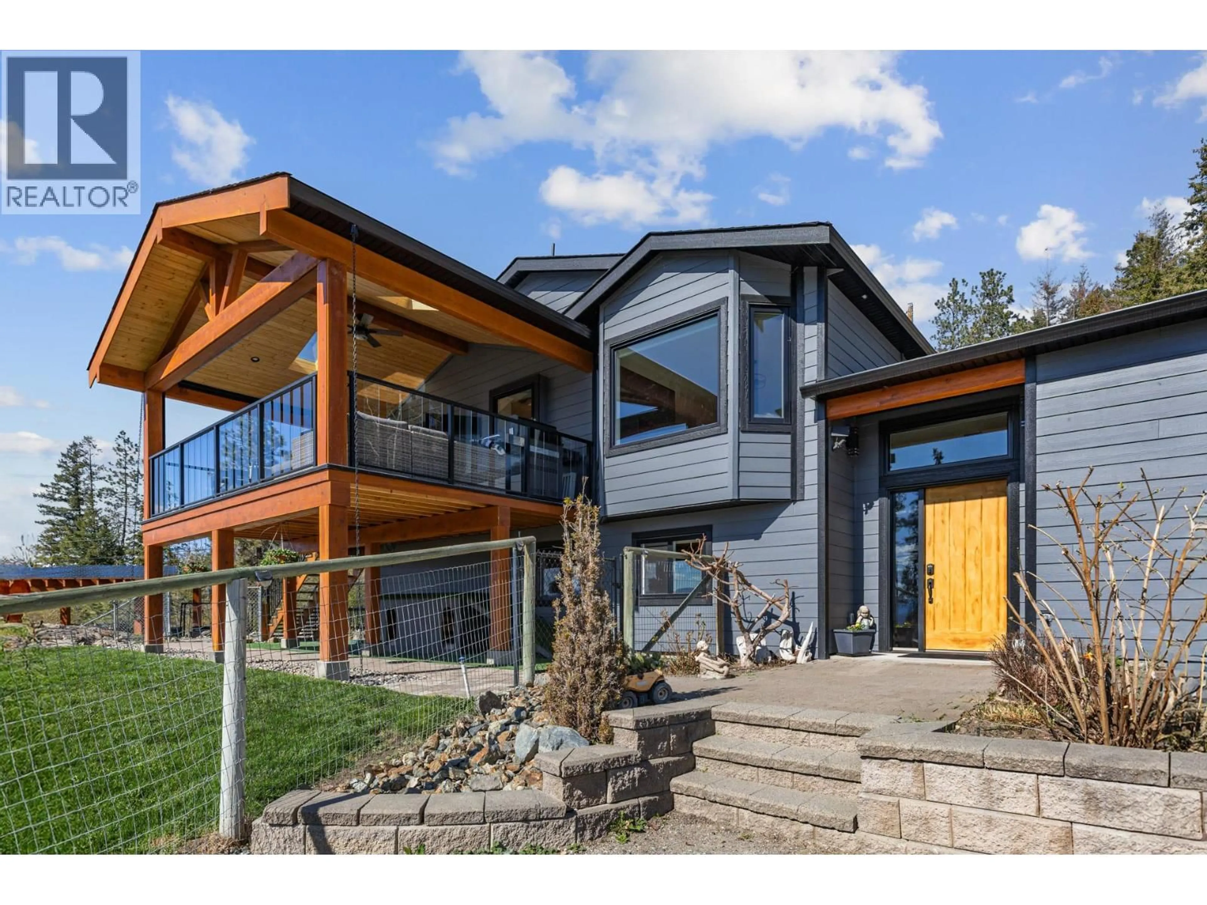 Home with brick exterior material, mountain view for 6025 FARMERS DRIVE, Kelowna British Columbia V1P1A3