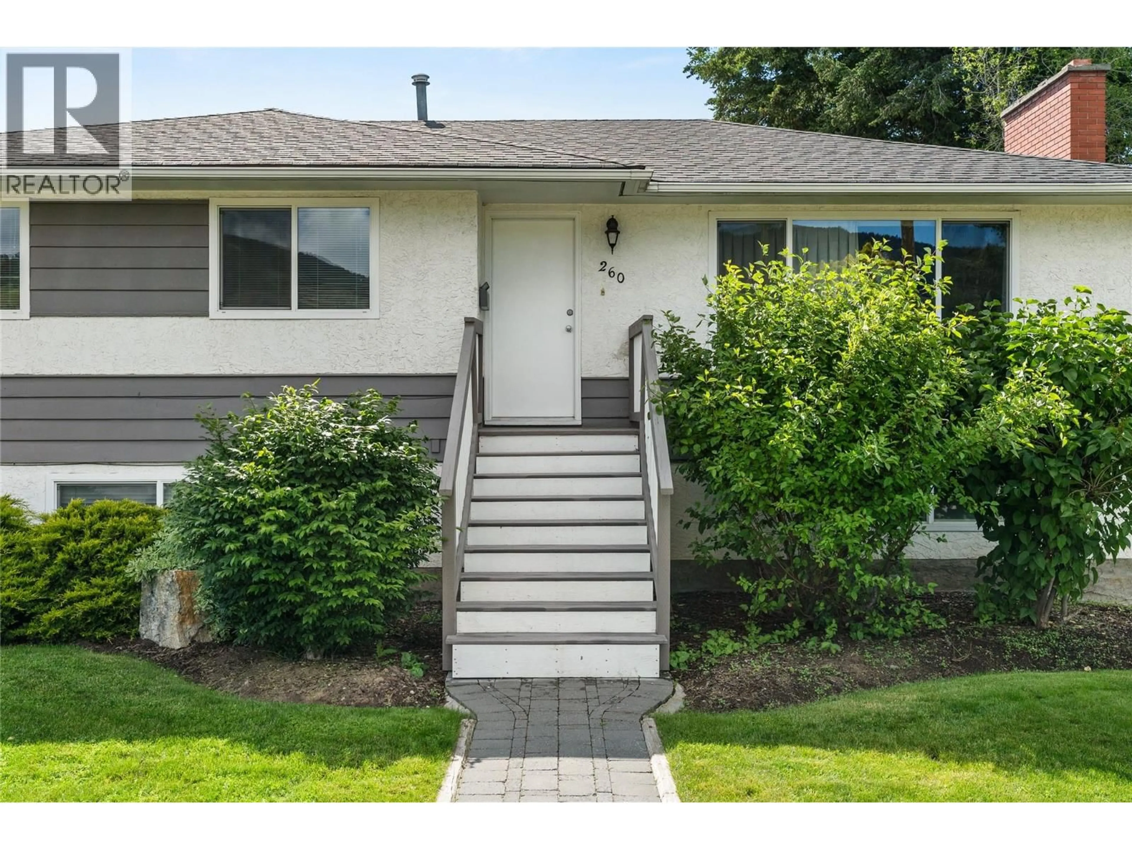 Home with vinyl exterior material, street for 260 GIBBS ROAD, Kelowna British Columbia V1X2W1
