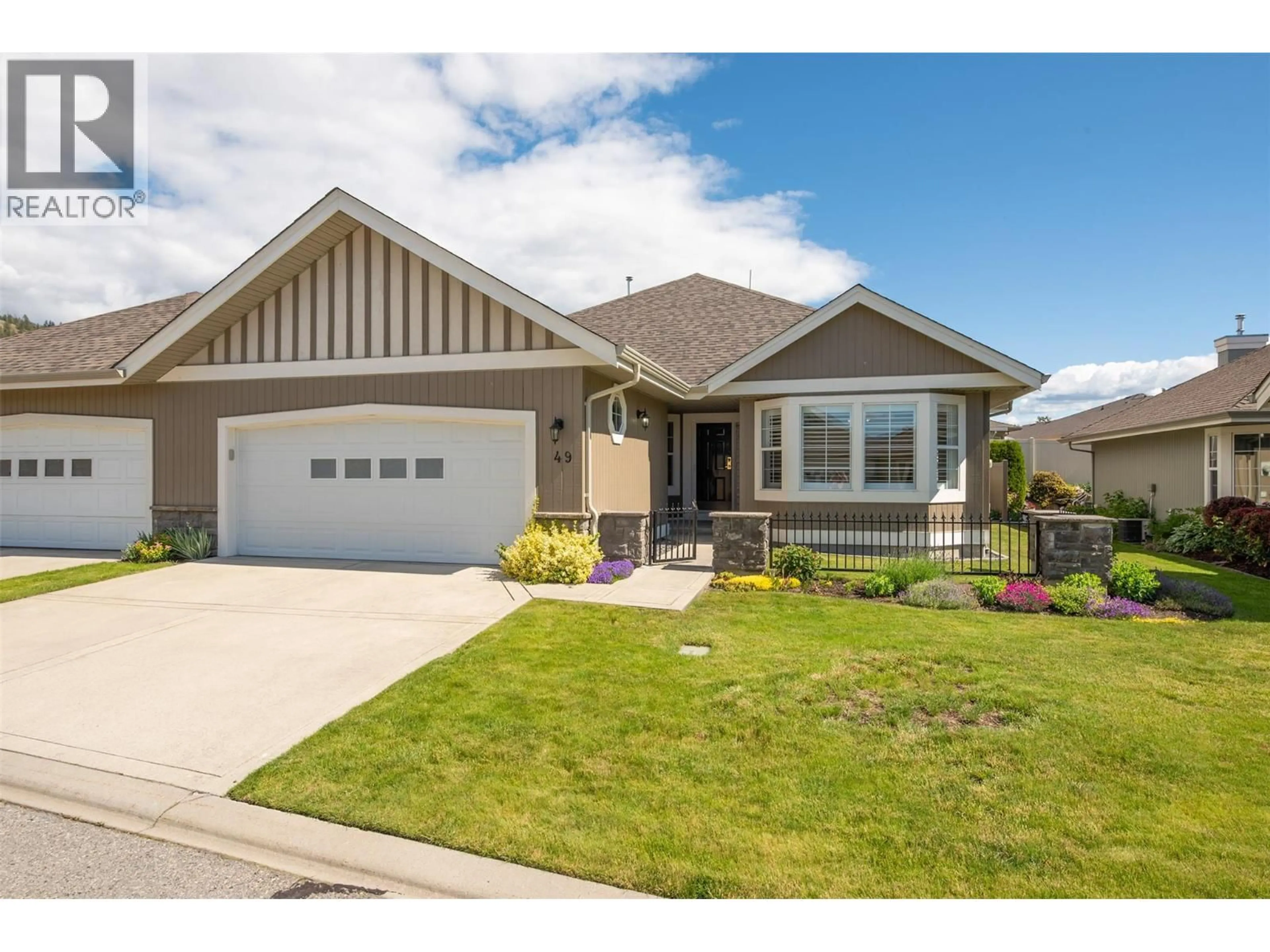 Home with vinyl exterior material, street for 49 - 680 VALLEY ROAD, Kelowna British Columbia V1V2J3