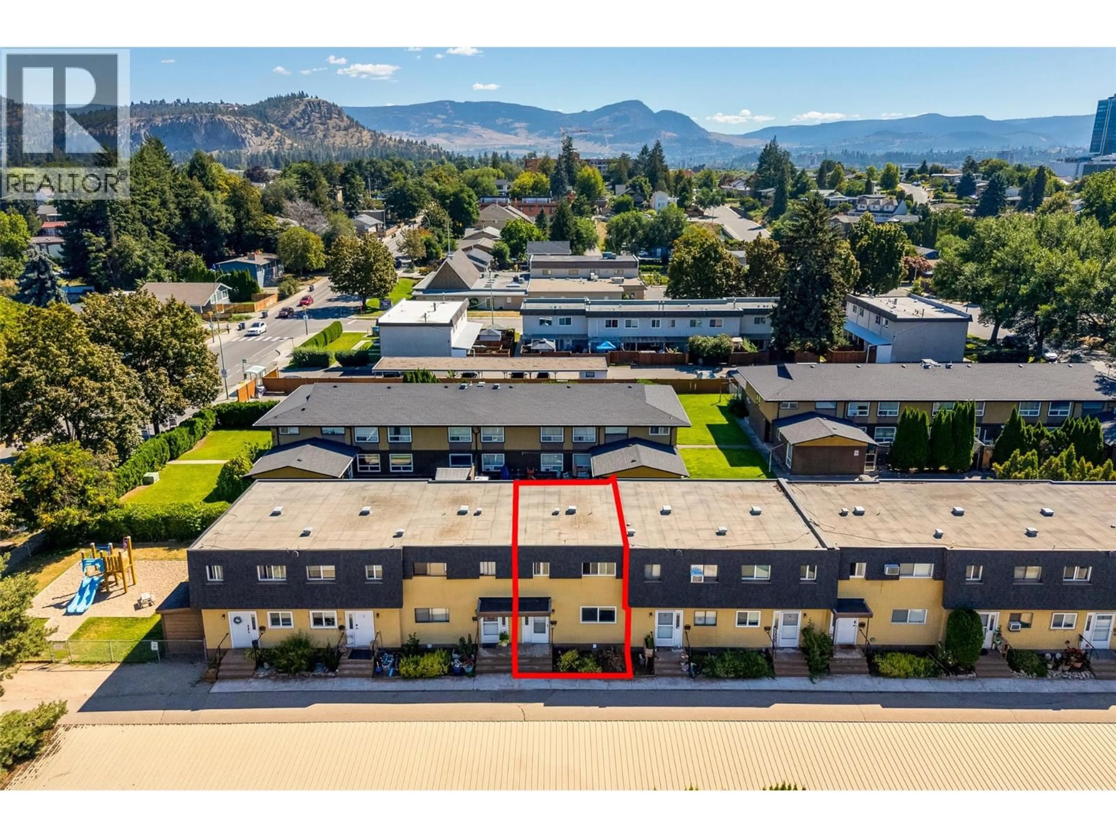 A pic from outside/outdoor area/front of a property/back of a property/a pic from drone, mountain view for 4 - 1283 BERNARD AVENUE, Kelowna British Columbia V1Y6R3