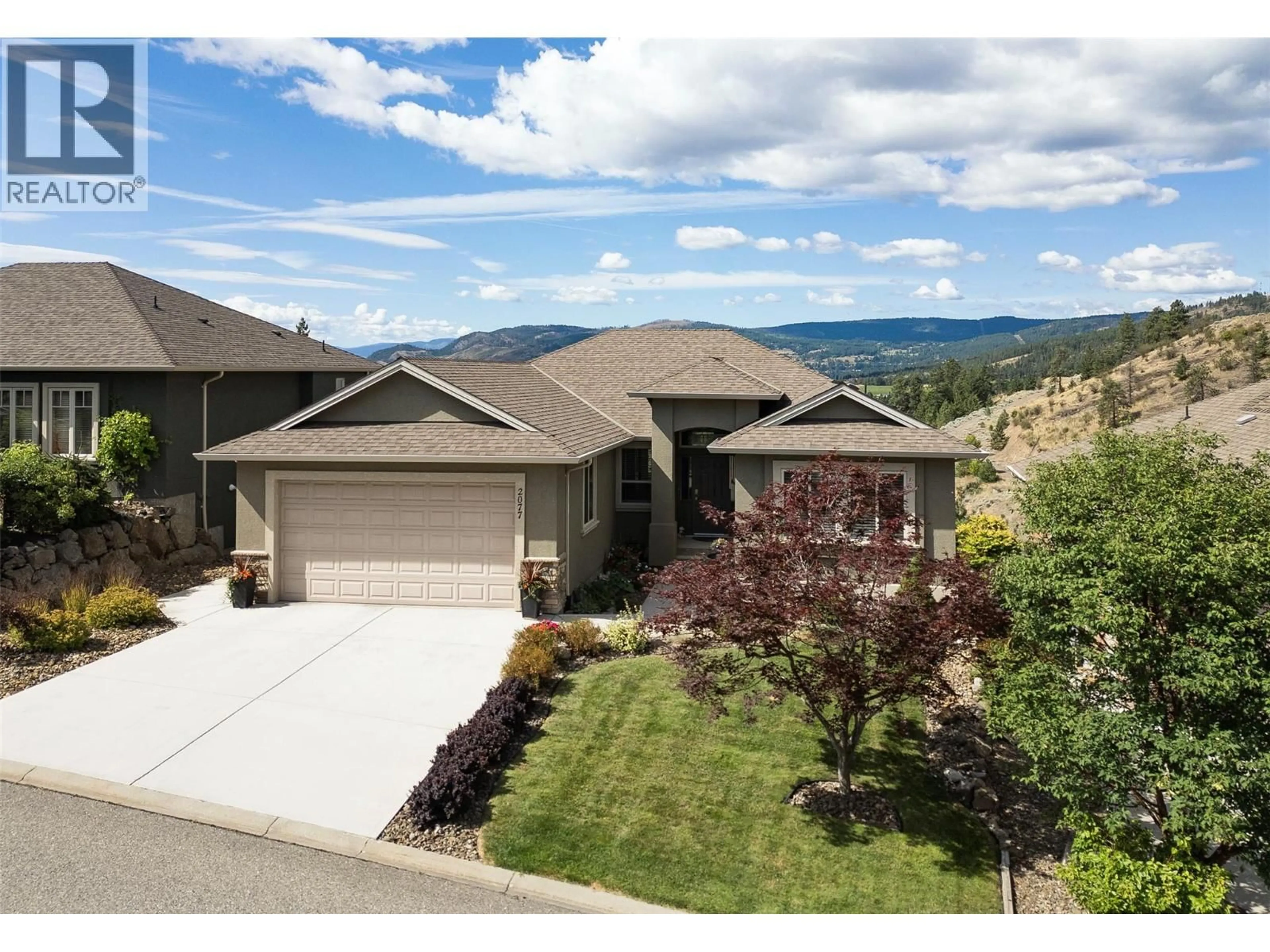 A pic from outside/outdoor area/front of a property/back of a property/a pic from drone, mountain view for 2077 CORNERSTONE DRIVE, West Kelowna British Columbia V4T2Y3