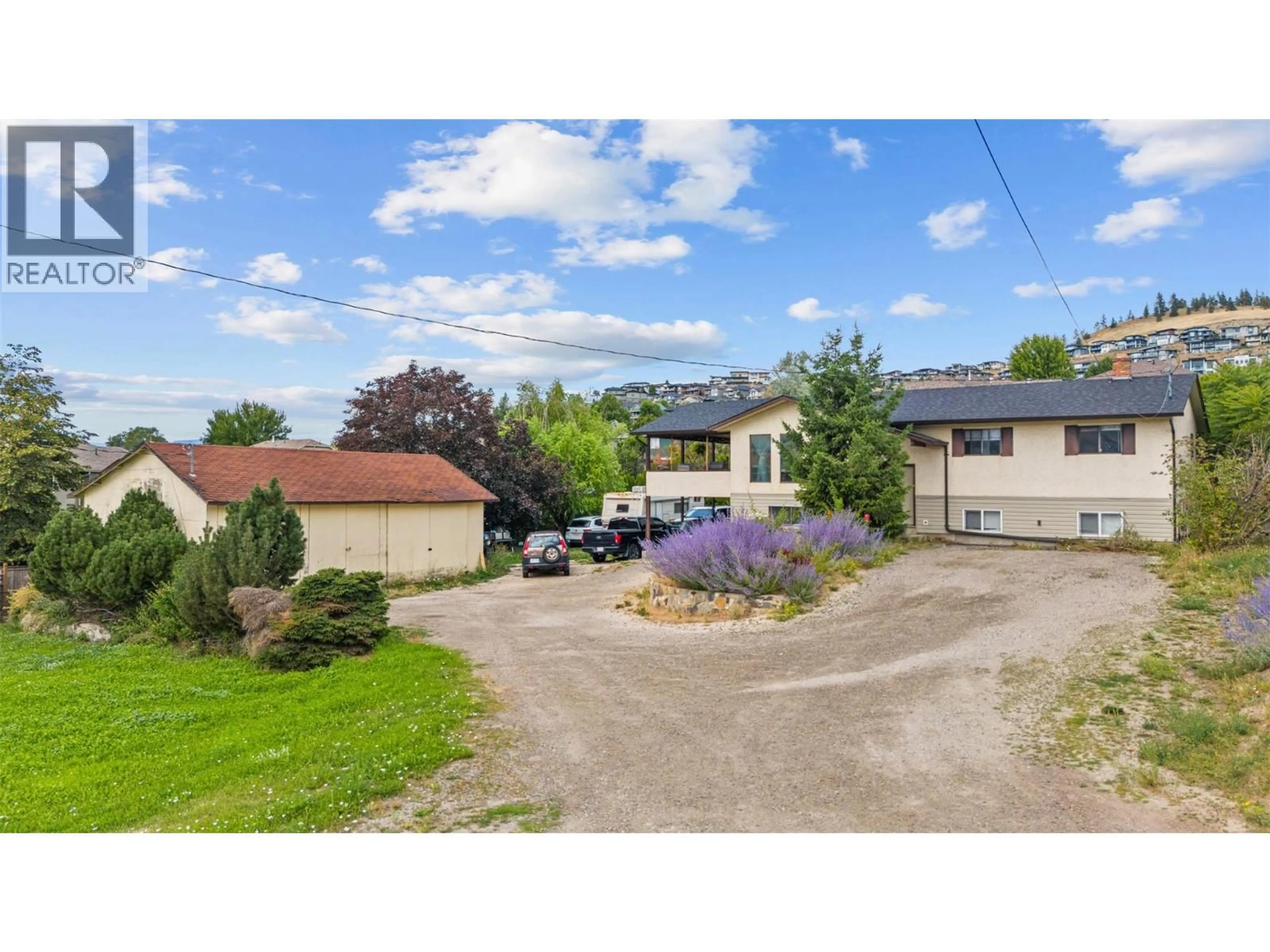 A pic from outside/outdoor area/front of a property/back of a property/a pic from drone, street for 1584 HIGHWAY 33 OTHER EAST, Kelowna British Columbia V1P1L9