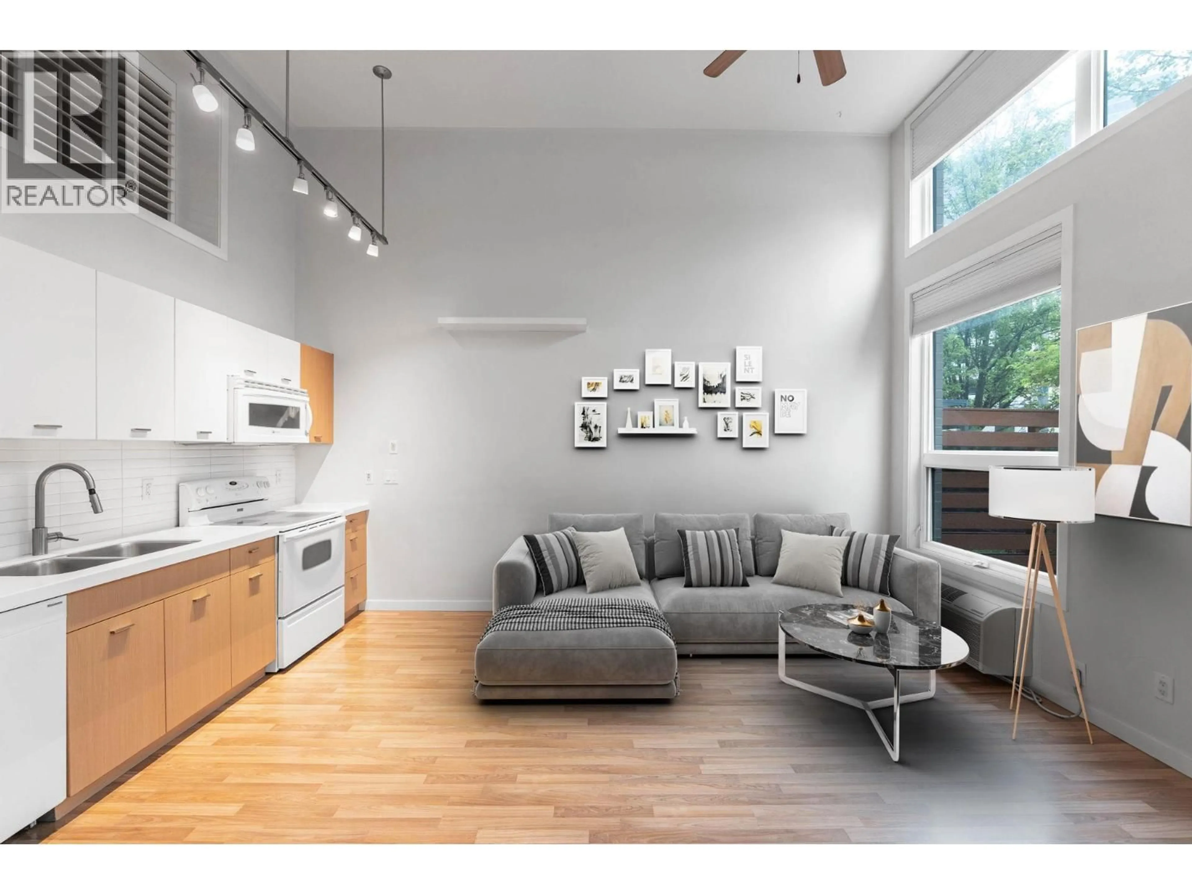 Living room with furniture, wood/laminate floor for 7 - 1550 DICKSON AVENUE, Kelowna British Columbia V1Y9Y8