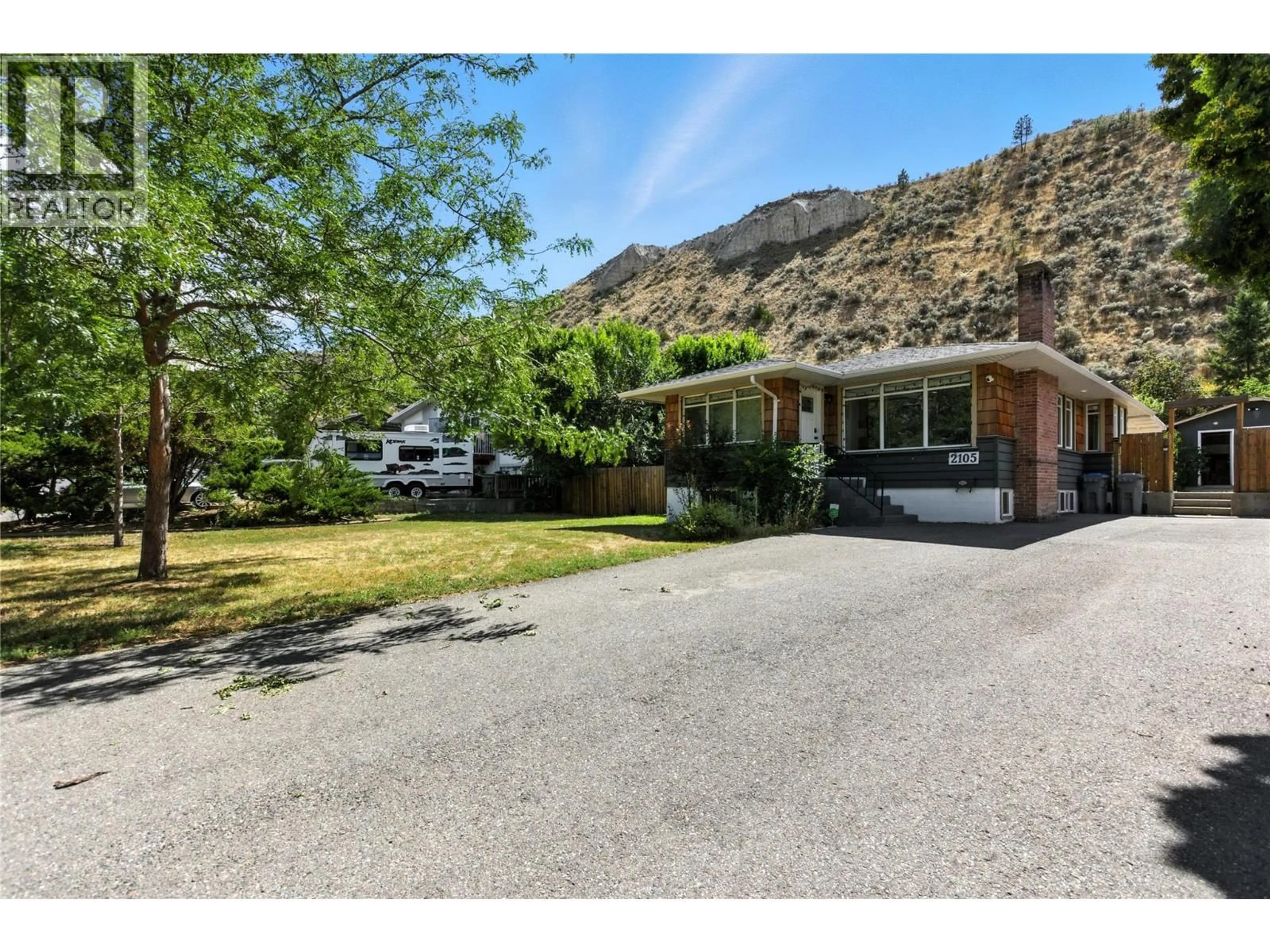 A pic from outside/outdoor area/front of a property/back of a property/a pic from drone, mountain view for 2105 VALLEYVIEW DRIVE, Kamloops British Columbia V2C4C3