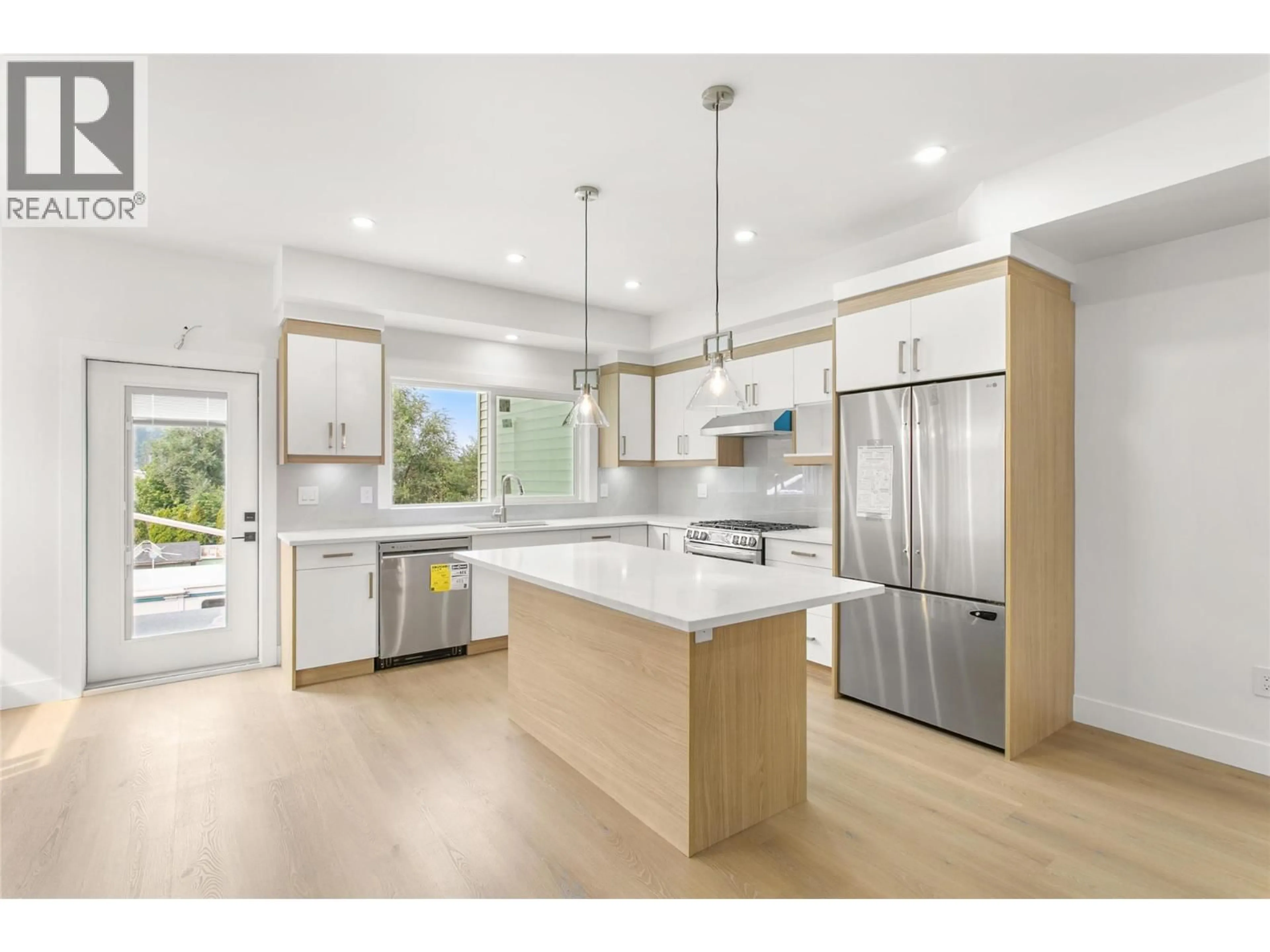 Open concept kitchen, wood/laminate floor for 2709 HEWL ROAD, West Kelowna British Columbia V1Z2M5