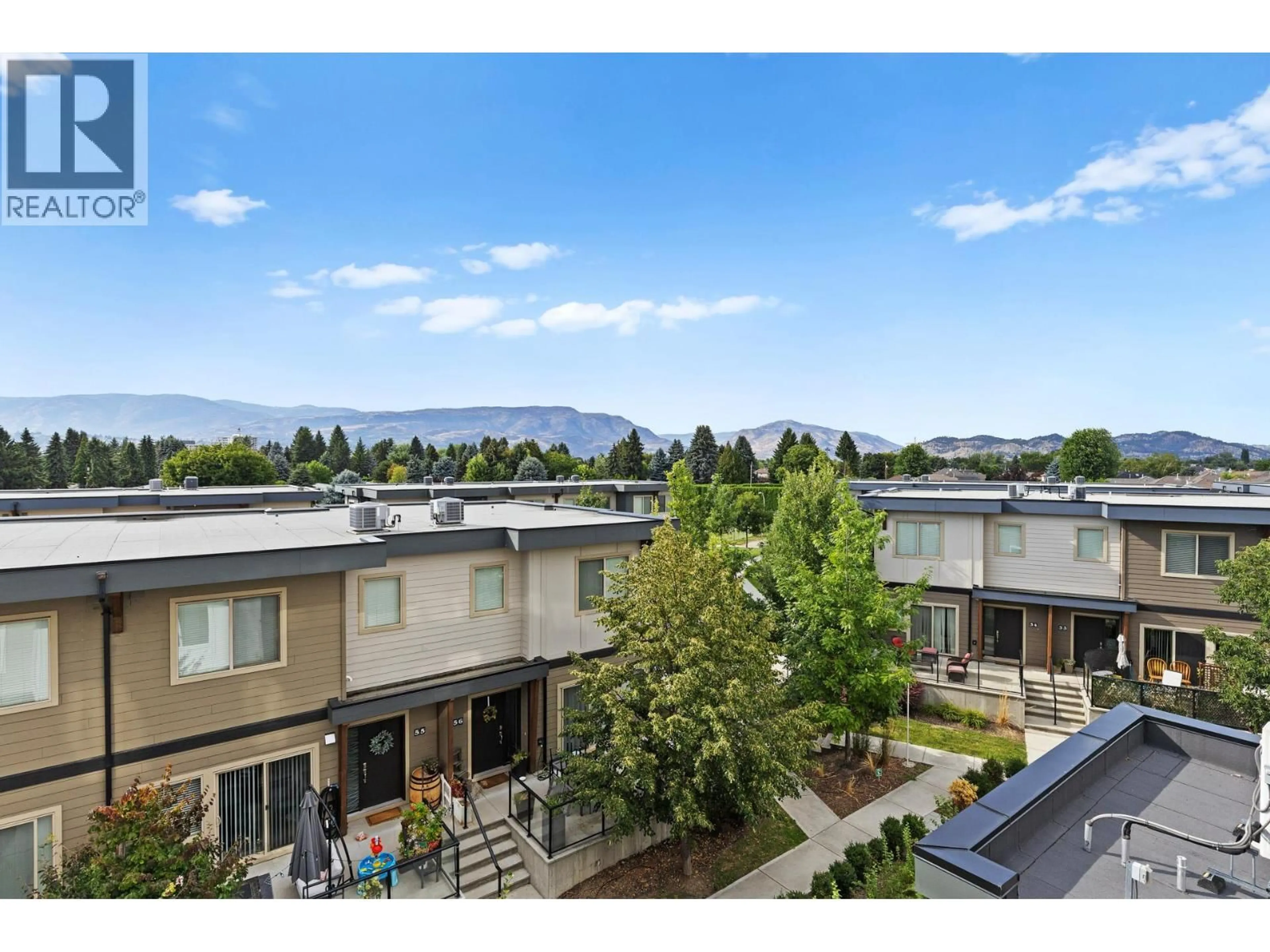 A pic from outside/outdoor area/front of a property/back of a property/a pic from drone, mountain view for 405 - 3634 MISSION SPRINGS DRIVE, Kelowna British Columbia V1W0C9