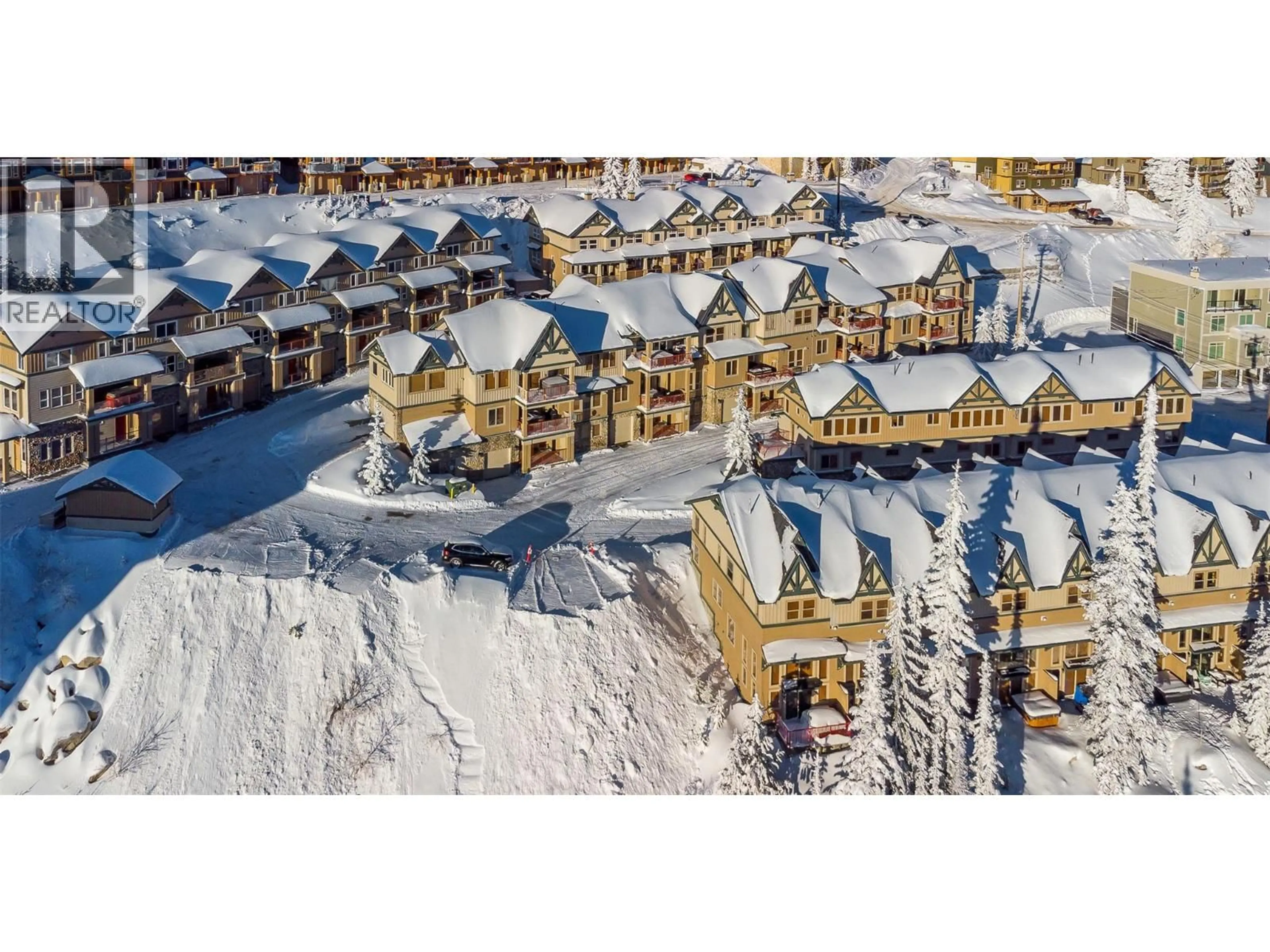 A pic from outside/outdoor area/front of a property/back of a property/a pic from drone, street for 29 - 7640 PORCUPINE ROAD, Big White British Columbia V1P1T4