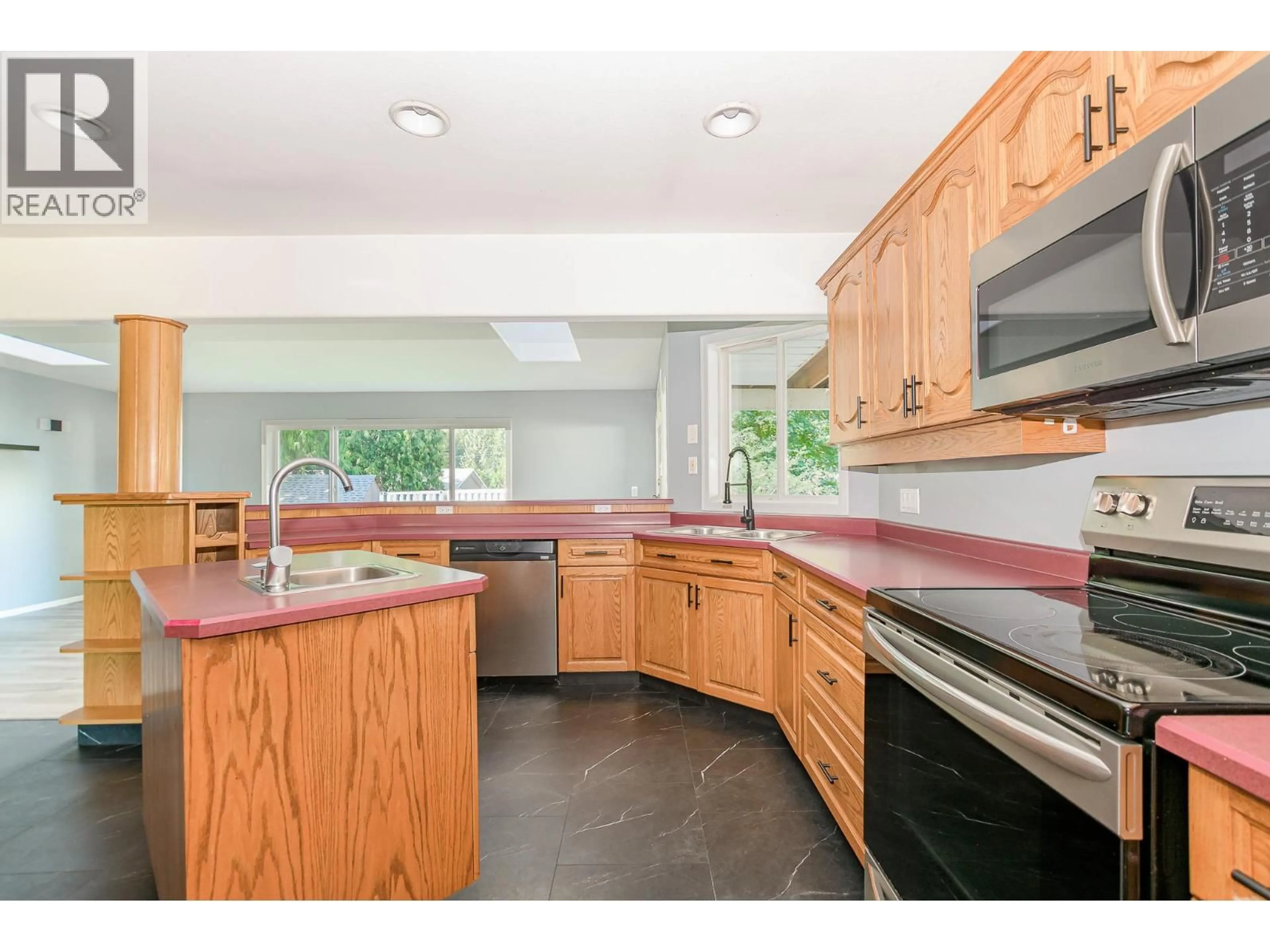 Open concept kitchen, ceramic/tile floor for 714 MAPLE STREET, Sicamous British Columbia V0E2V1