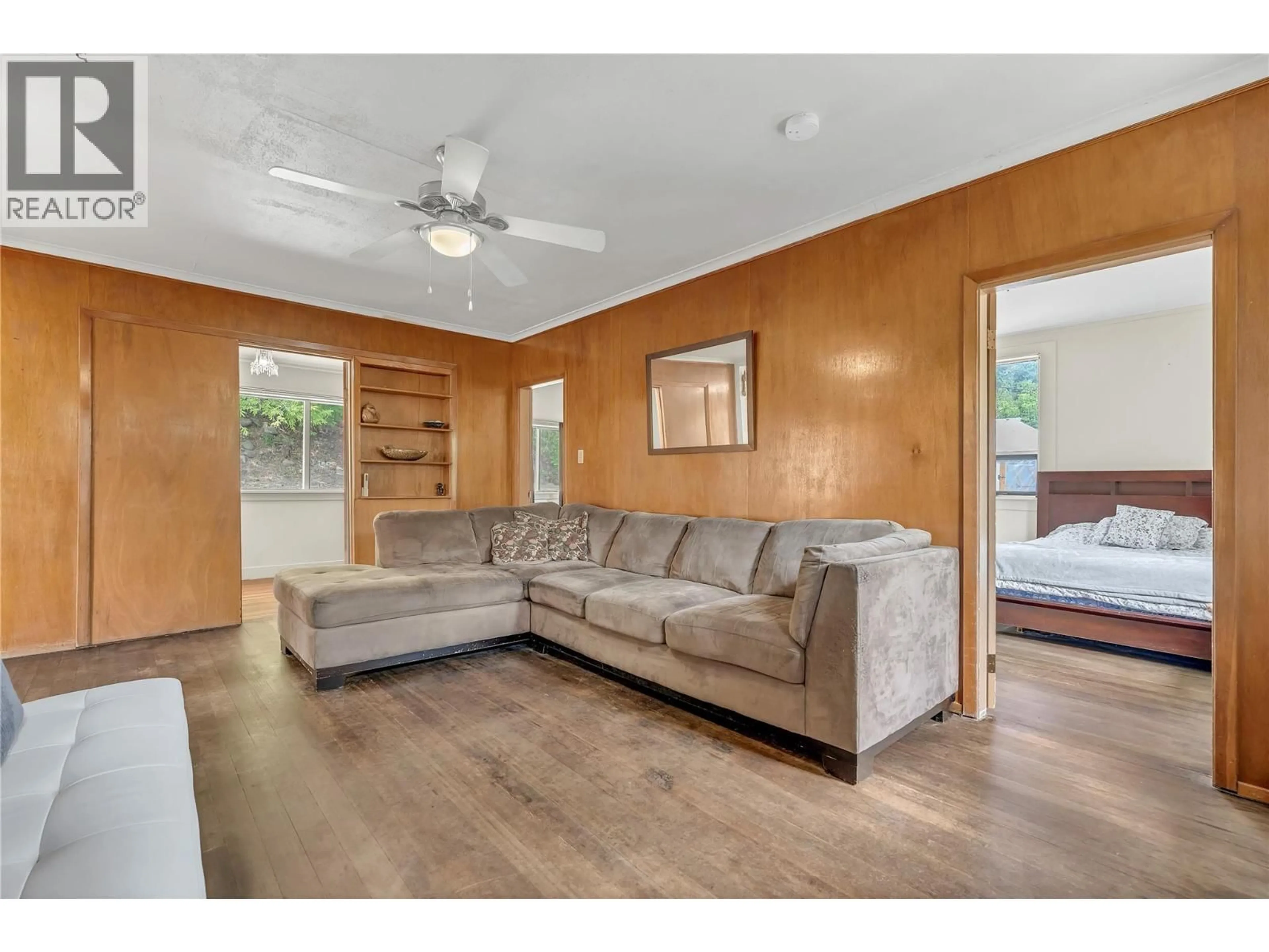 Living room with furniture, wood/laminate floor for 241 PENRYN AVENUE, Princeton British Columbia V0X1W0