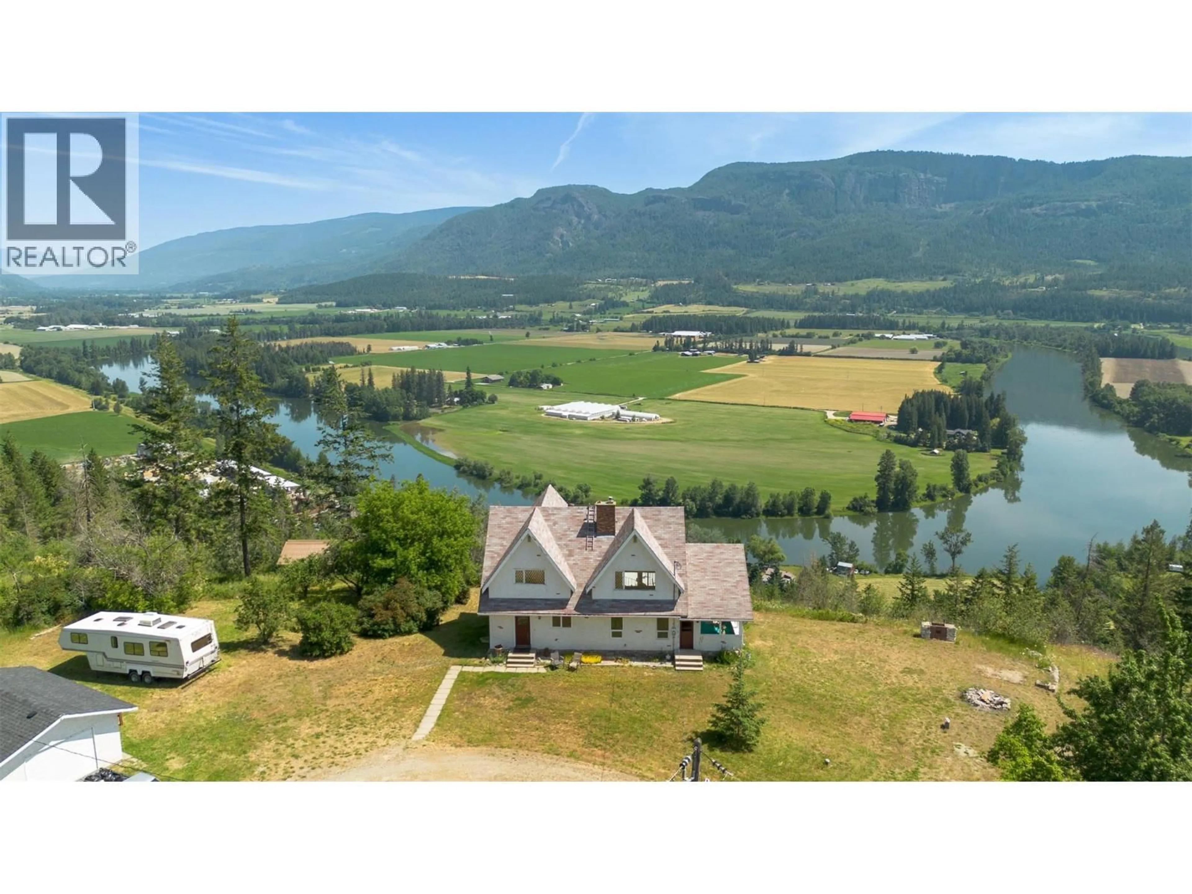 A pic from outside/outdoor area/front of a property/back of a property/a pic from drone, water/lake/river/ocean view for 137 NICHLOUS ROAD, Enderby British Columbia V4Y4G4