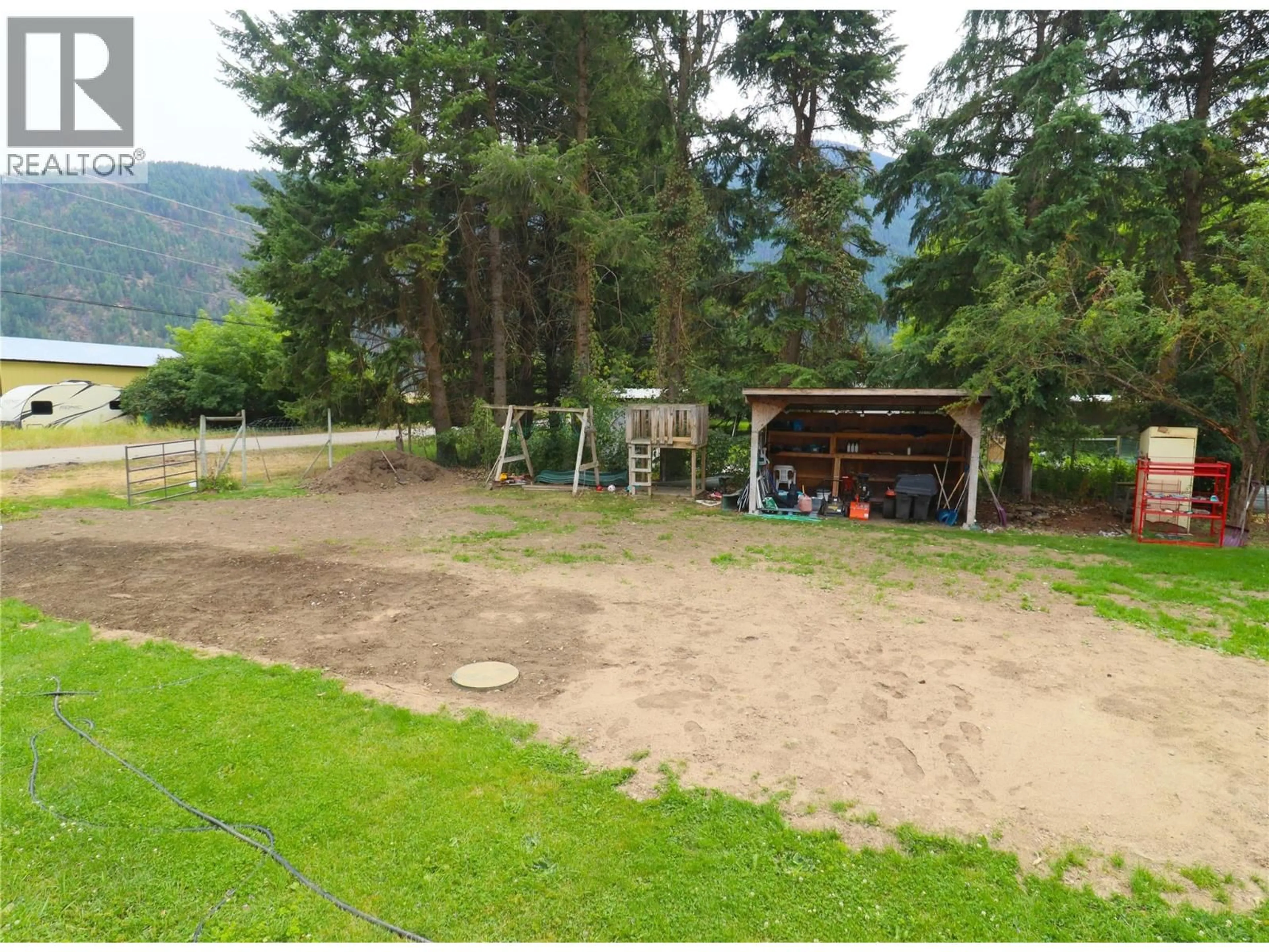 A pic from outside/outdoor area/front of a property/back of a property/a pic from drone, mountain view for 510 CARSON ROAD, Grand Forks British Columbia V0H1H4