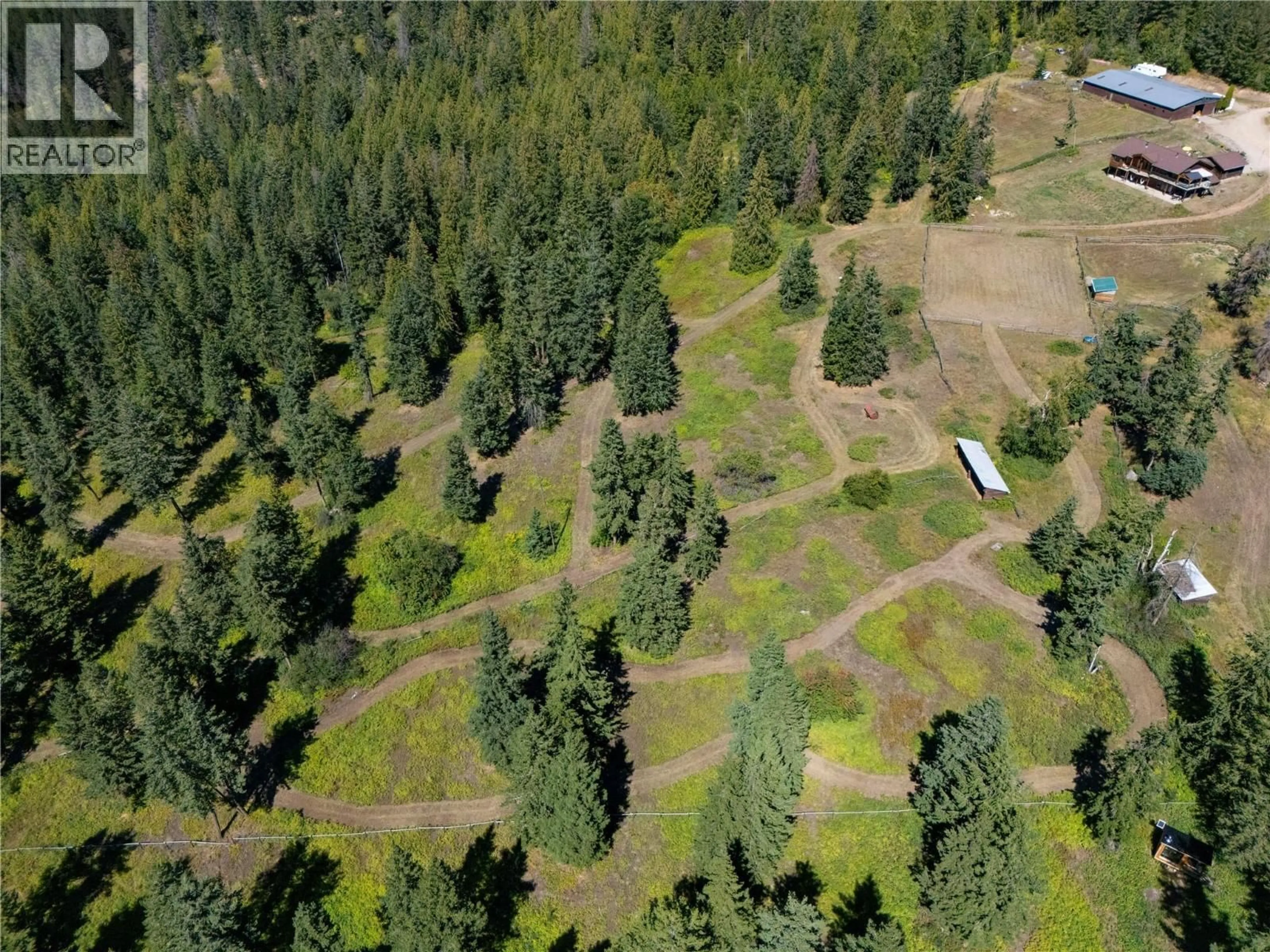 A pic from outside/outdoor area/front of a property/back of a property/a pic from drone, forest/trees view for 7940 KEDDLESTON ROAD, Vernon British Columbia V1B3N4