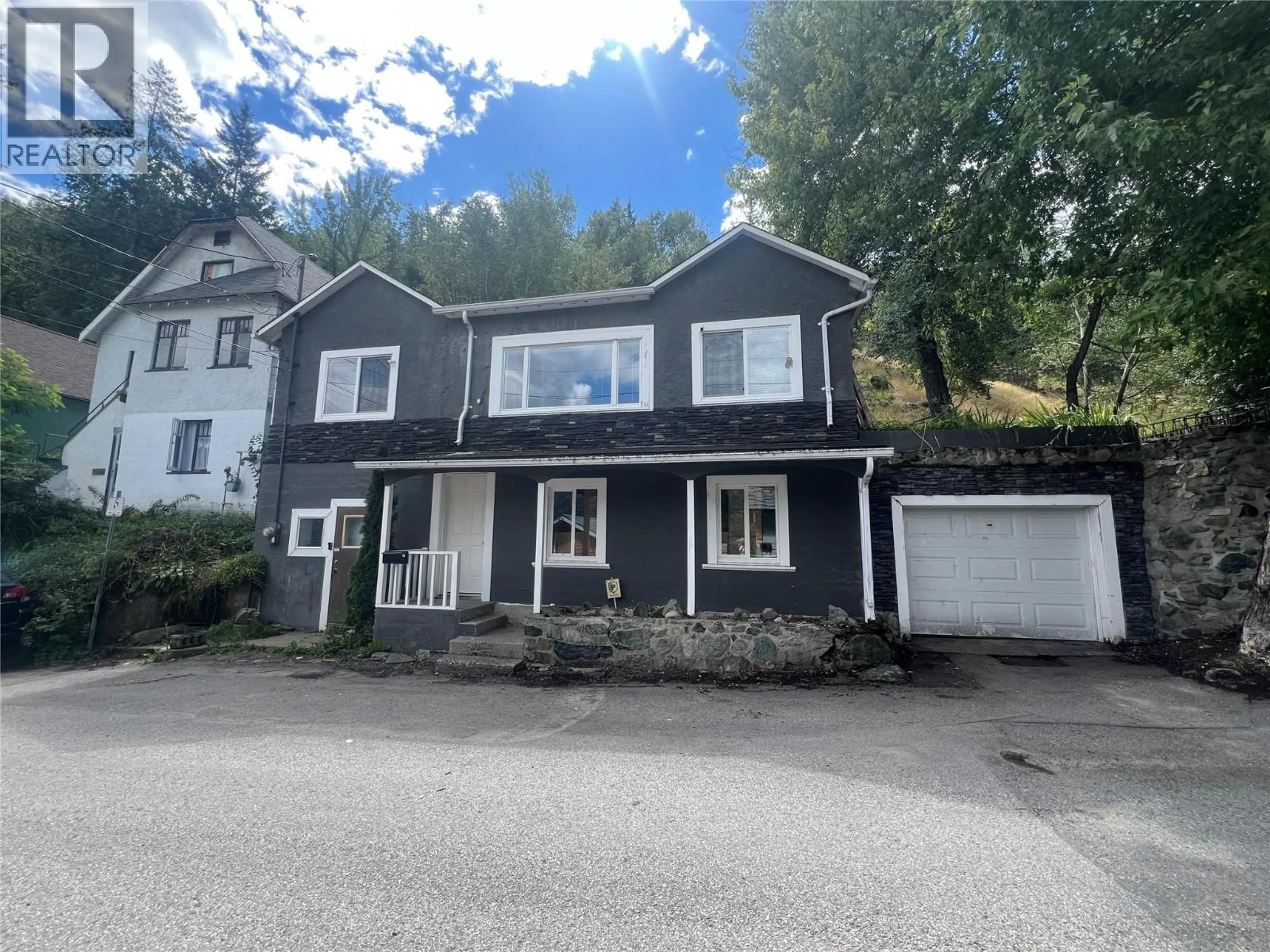 A pic from outside/outdoor area/front of a property/back of a property/a pic from drone, street for 1916 WILMES LANE LANE, Trail British Columbia V1R4H3