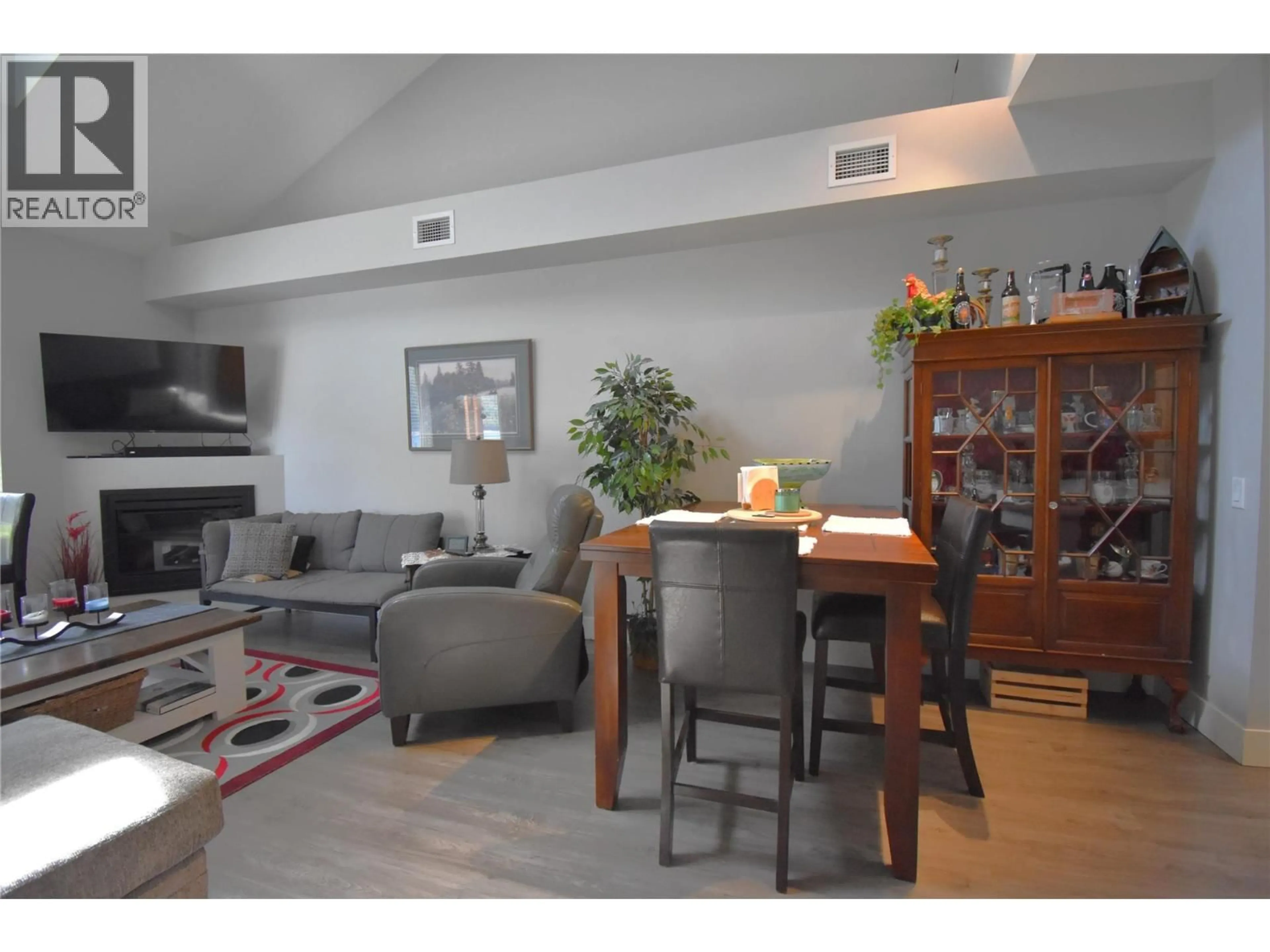 Living room with furniture, wood/laminate floor for 314 - 5570 BROADWATER ROAD, Castlegar British Columbia V1N0A1