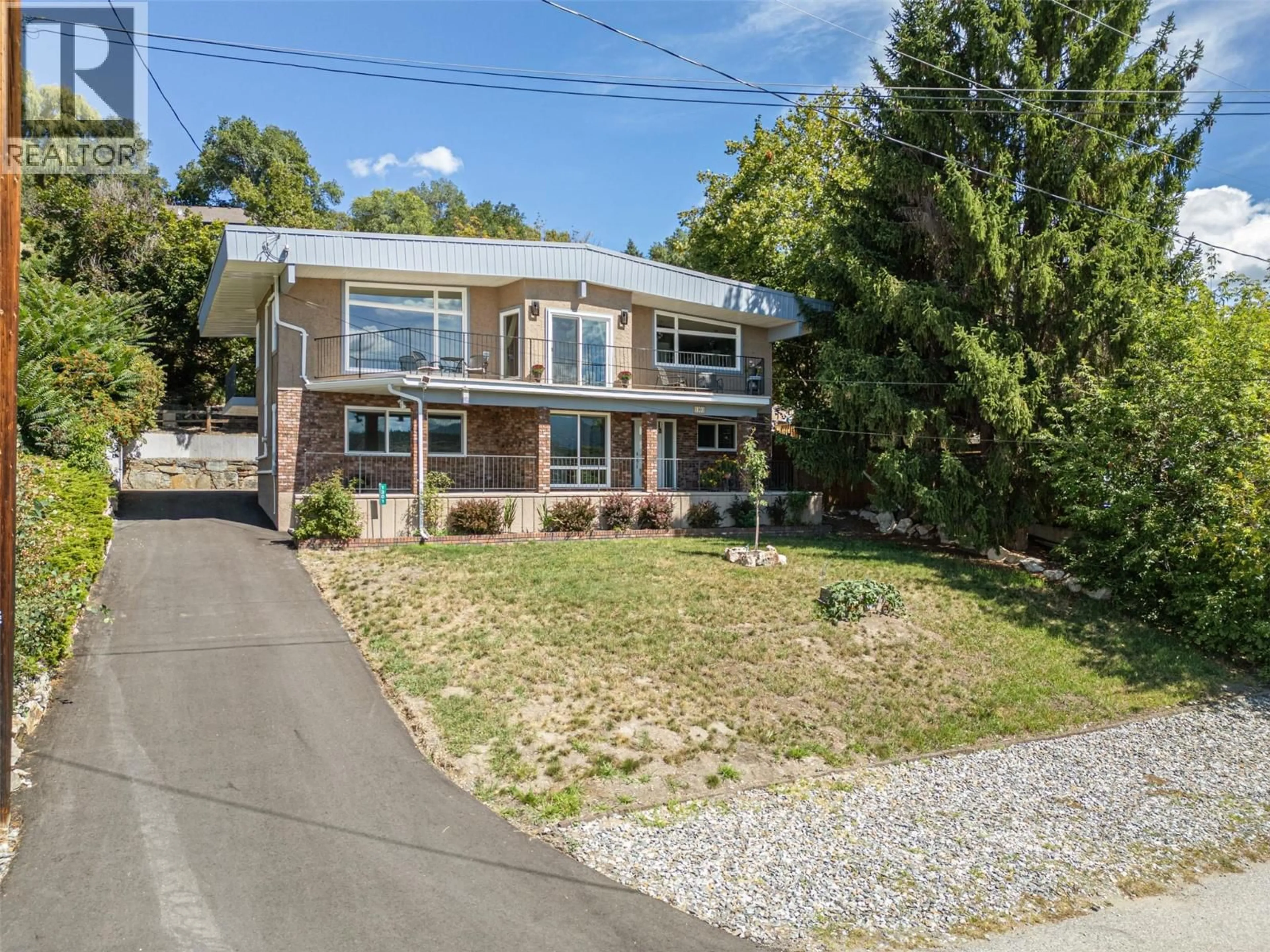 A pic from outside/outdoor area/front of a property/back of a property/a pic from drone, street for 1301 BEGLEY ROAD, Kelowna British Columbia V1P1K8