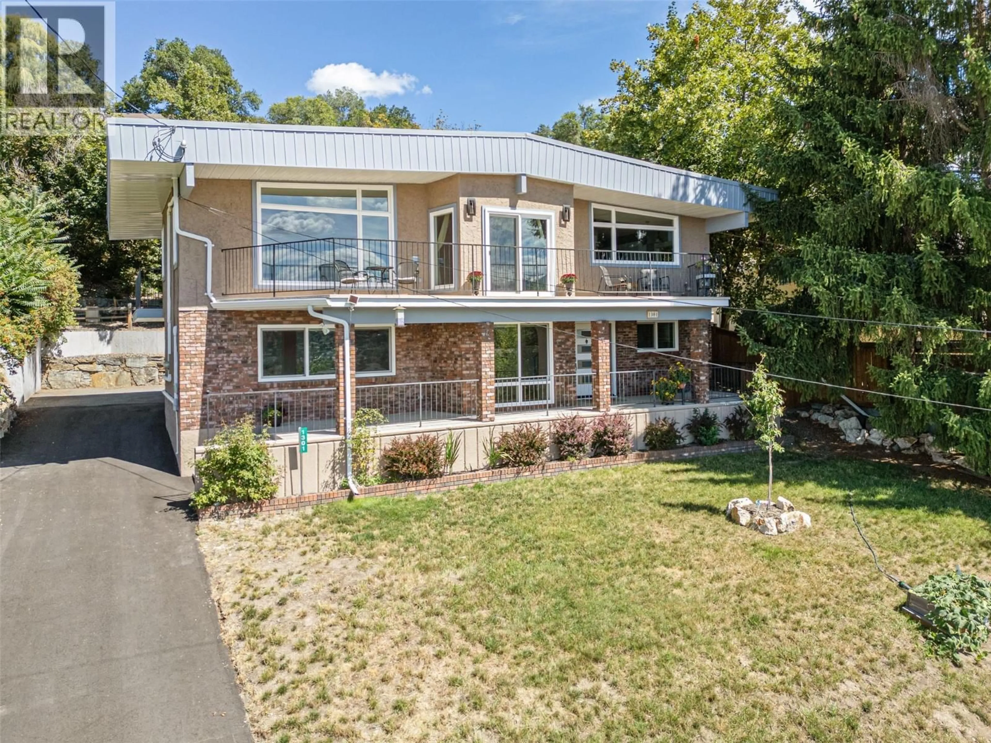 A pic from outside/outdoor area/front of a property/back of a property/a pic from drone, street for 1301 BEGLEY ROAD, Kelowna British Columbia V1P1K8