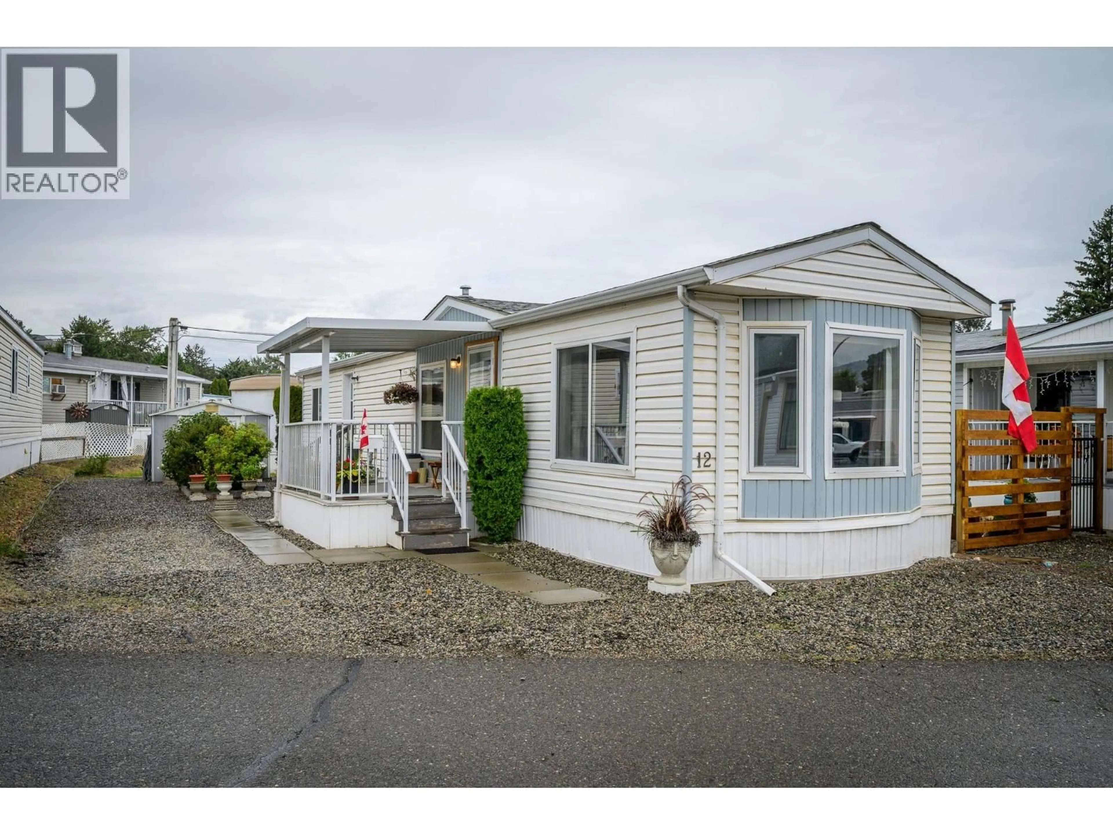 Home with vinyl exterior material, street for 12 PLUTO DRIVE, Kamloops British Columbia V2B1A7