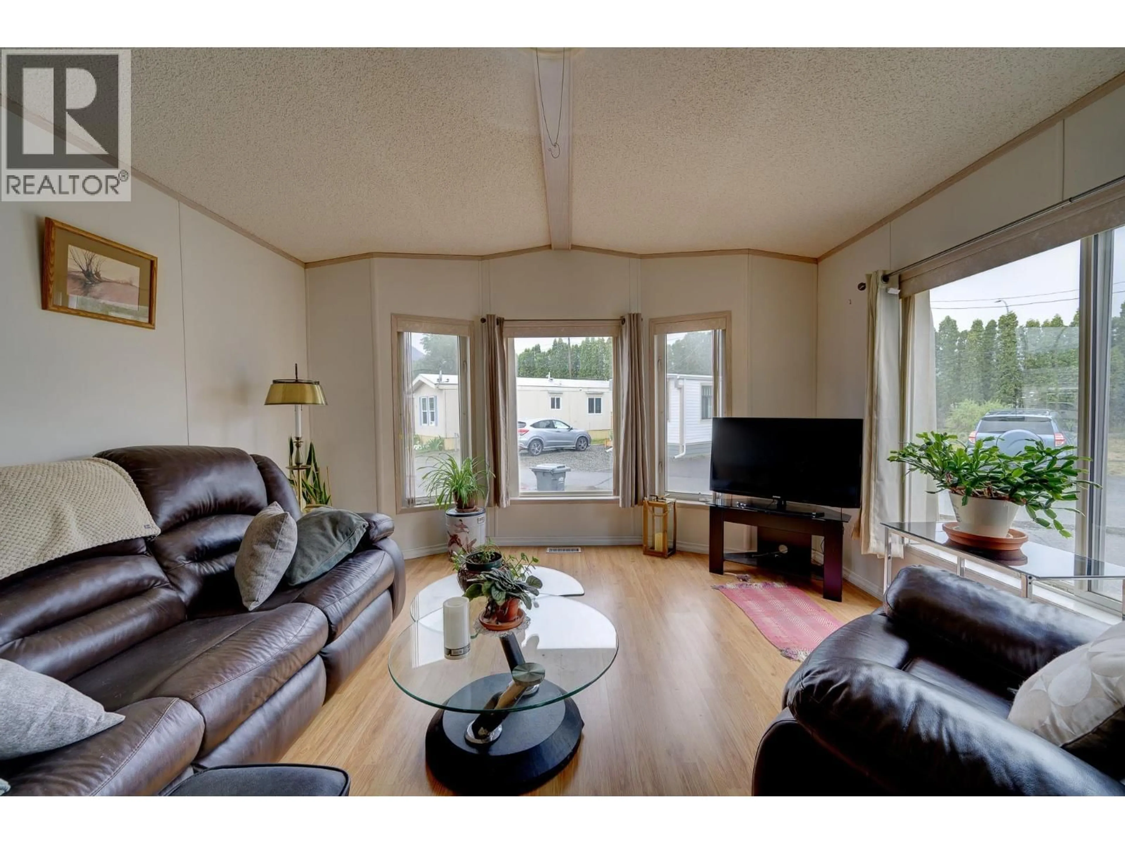 Living room with furniture, wood/laminate floor for 12 PLUTO DRIVE, Kamloops British Columbia V2B1A7