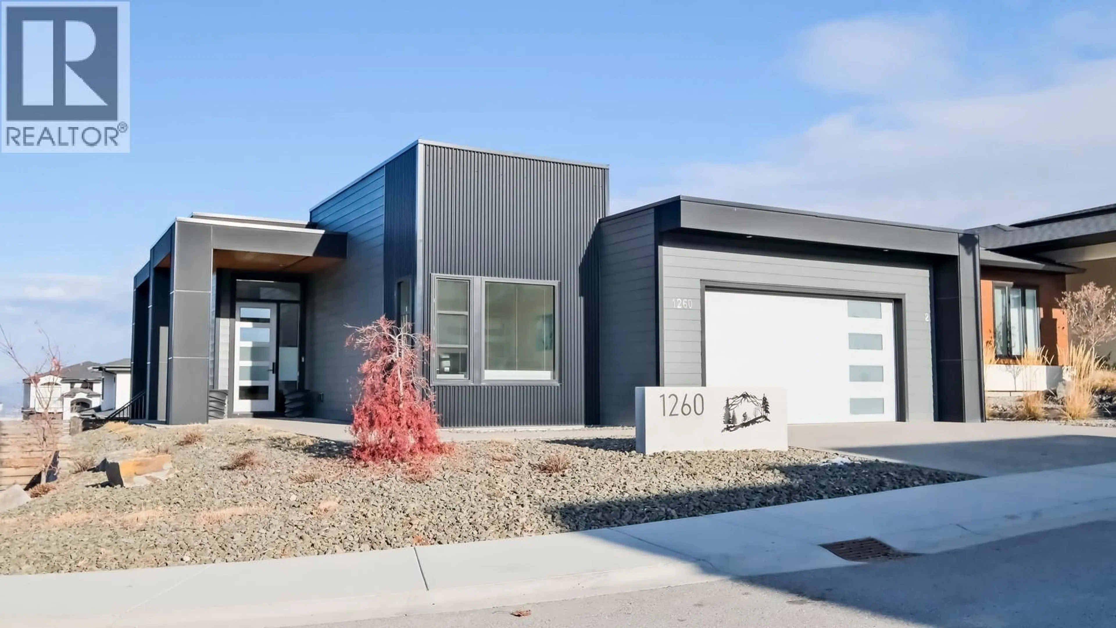 Home with vinyl exterior material, street for 1260 JACK SMITH ROAD, Kelowna British Columbia V1W5N1