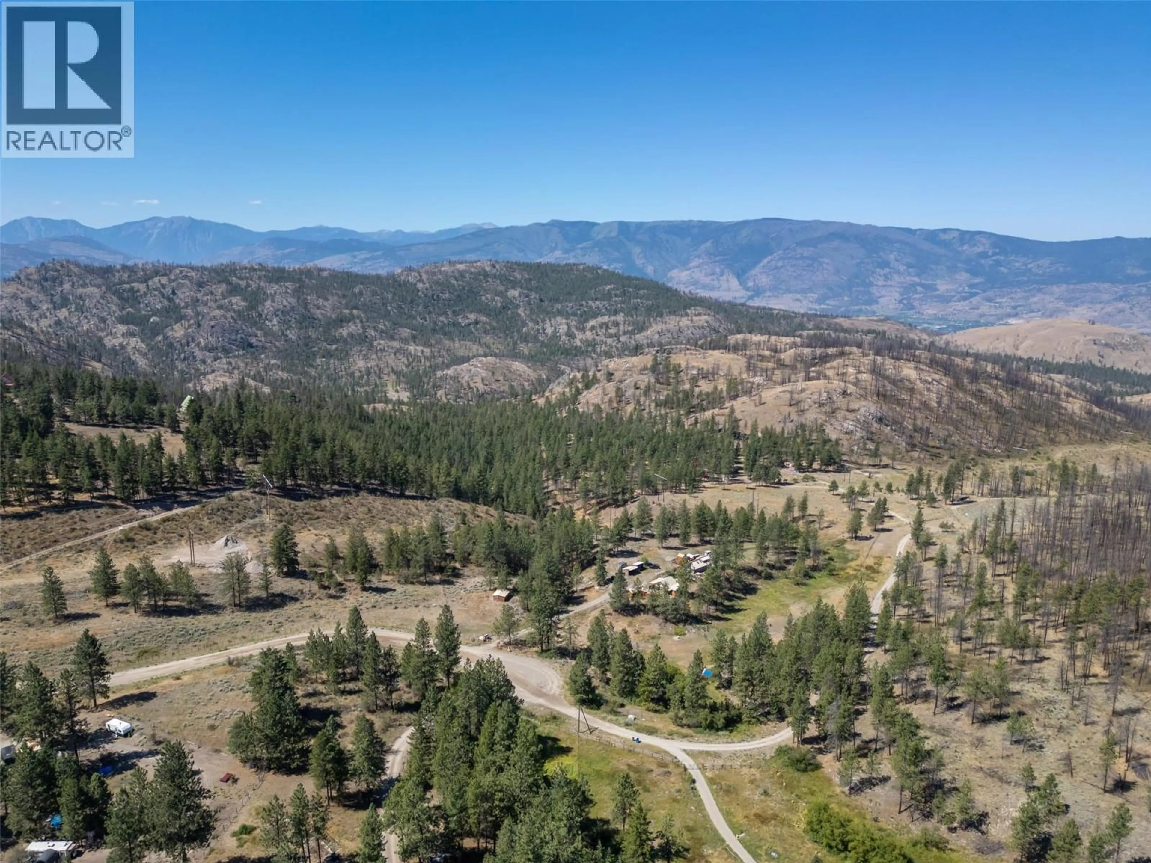 A pic from outside/outdoor area/front of a property/back of a property/a pic from drone, mountain view for 156 PORCUPINE PLACE, Oliver British Columbia V0H1T8