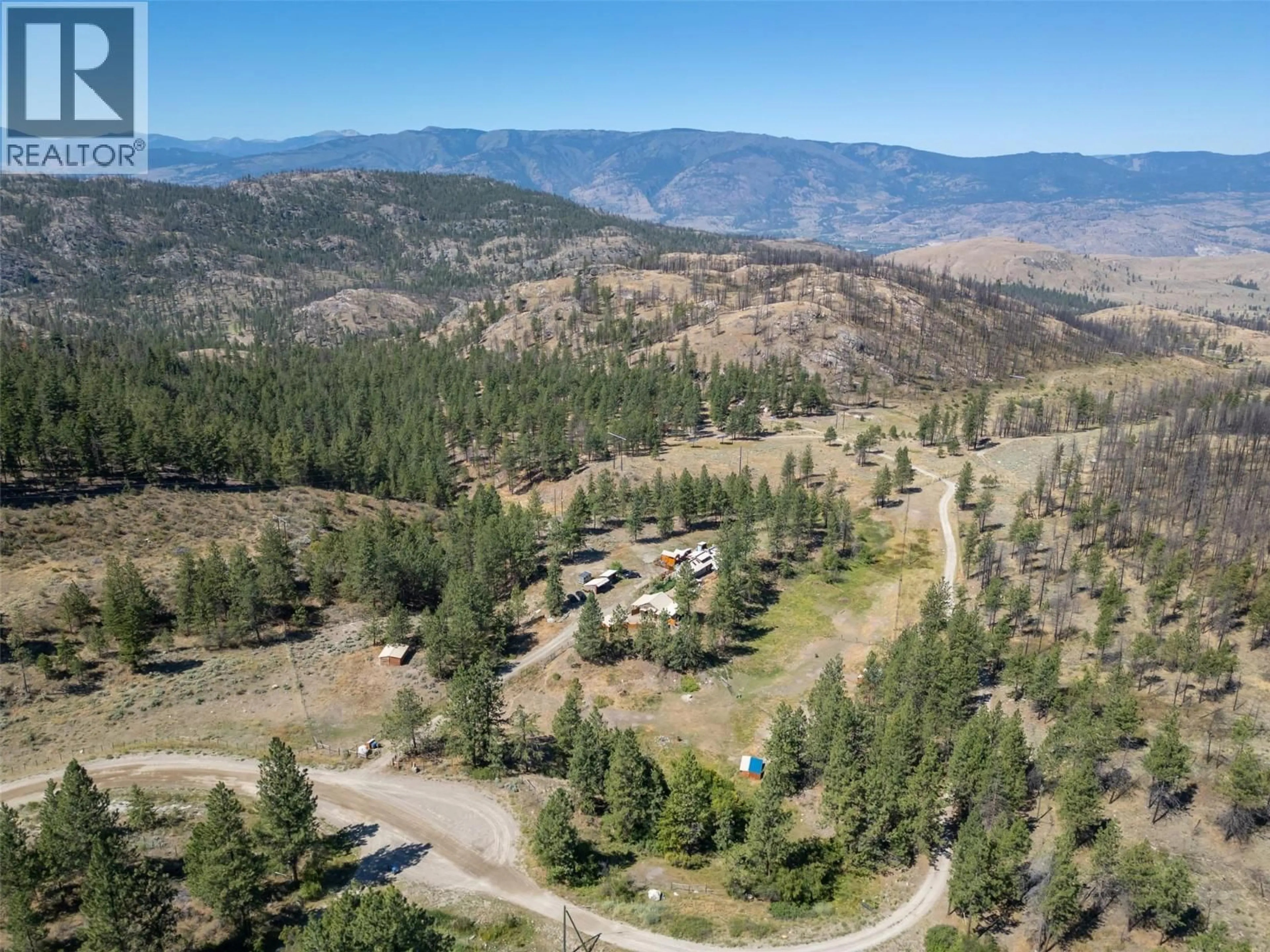A pic from outside/outdoor area/front of a property/back of a property/a pic from drone, mountain view for 156 PORCUPINE PLACE, Oliver British Columbia V0H1T8