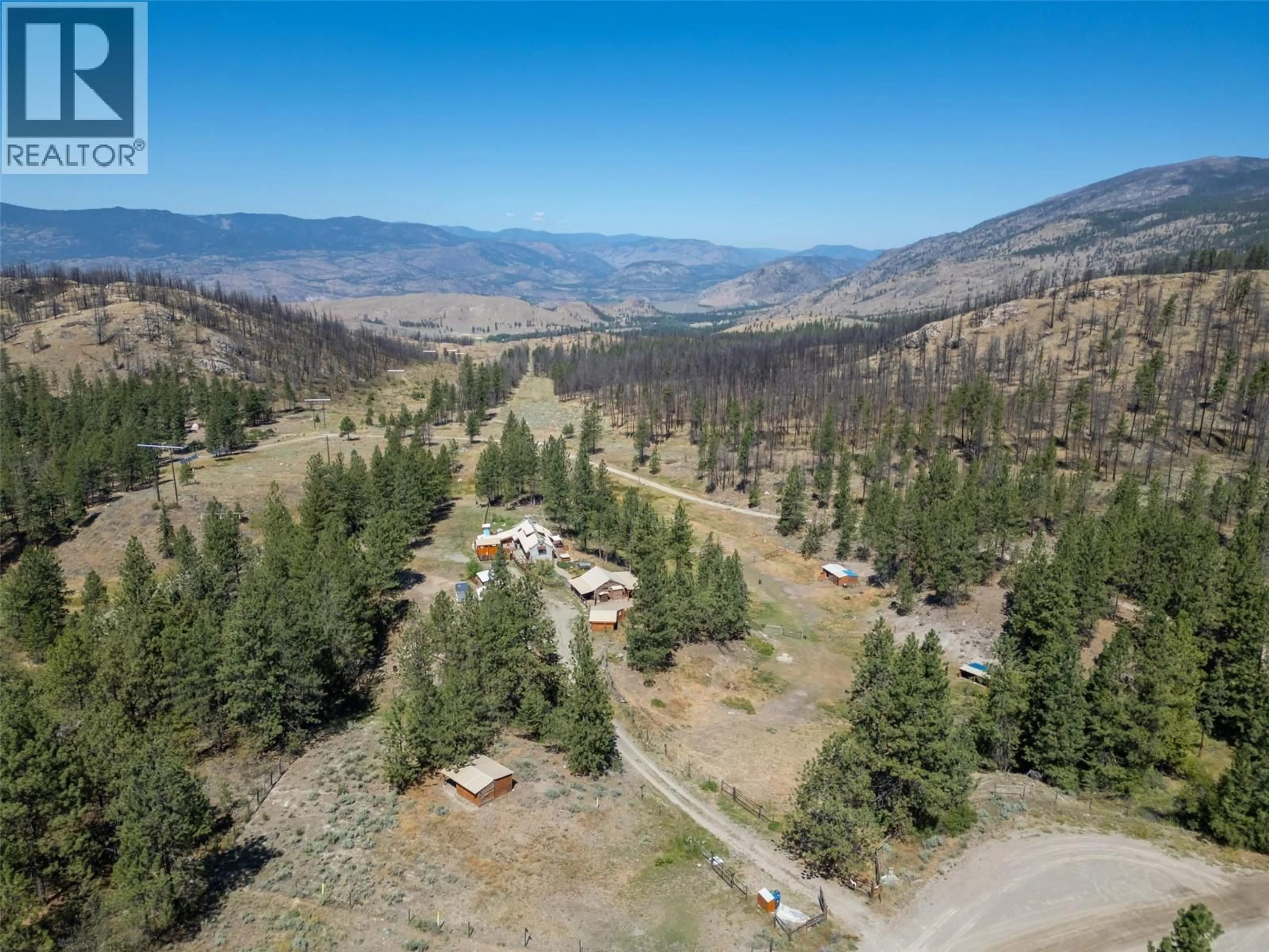 A pic from outside/outdoor area/front of a property/back of a property/a pic from drone, forest/trees view for 156 PORCUPINE PLACE, Oliver British Columbia V0H1T8